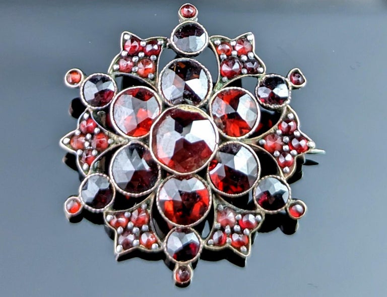 There is something so magical and mystical about antique Bohemian garnet pieces.

The rich deep red stones that shimmer from the faceted cuts, dancing flashes of wine red glistening over the path it casts in the light.

This antique Bohemian garnet