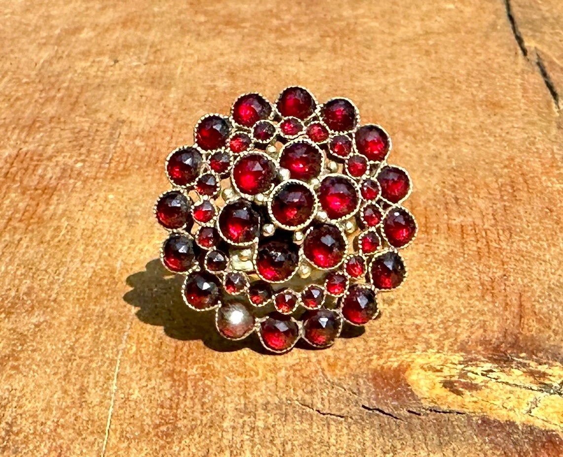 This is a gorgeous Belle Epoque - Victorian Bohemian Garnet Ring with four tiers of round faceted Garnets of great beauty.  The garnets are set in 