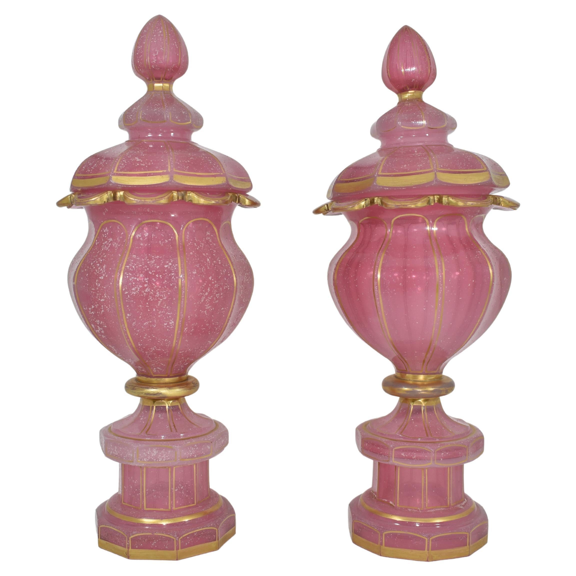 The pink alabaster glass pair of goblets embody the beauty of 19th century opal glass manufacture, Gilt all over, the vase is shaped in 10 side panels and features  turned-out necks with scalloped edges, further gilding on the base and cover,