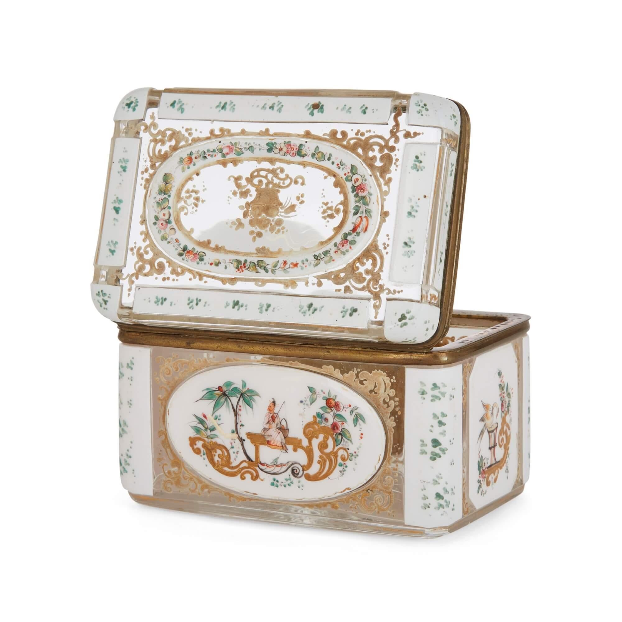Antique Bohemian glass box decorated in Chinoiserie style
Bohemian, 19th Century
Height 10cm, width 15cm, depth 10cm

This superb casket features intricate painted details atop its glass body. The box showcases the expert glassware emerging from