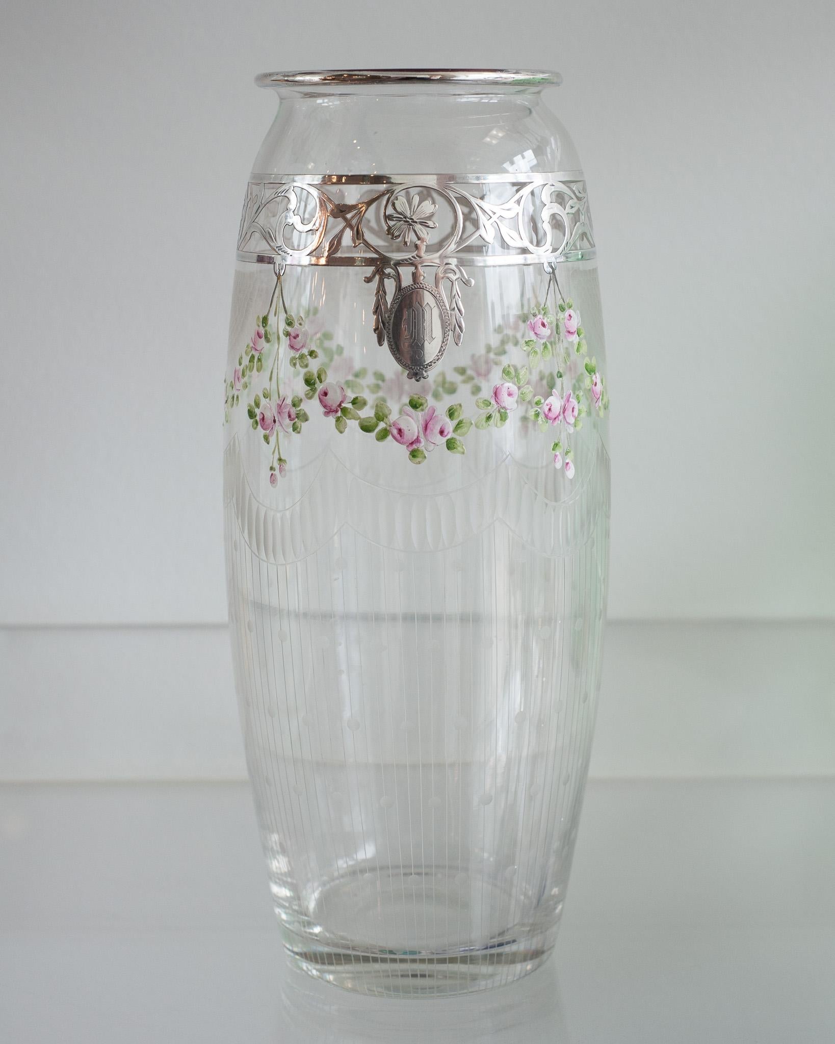 A beautiful antique Bohemian glass vase with enamel and sterling silver detail, ornately etched and hand painted with a floral motif. Wreaths of flowers in super fine detail are supporting a delicate silver trim. A perfect size for everyday use.