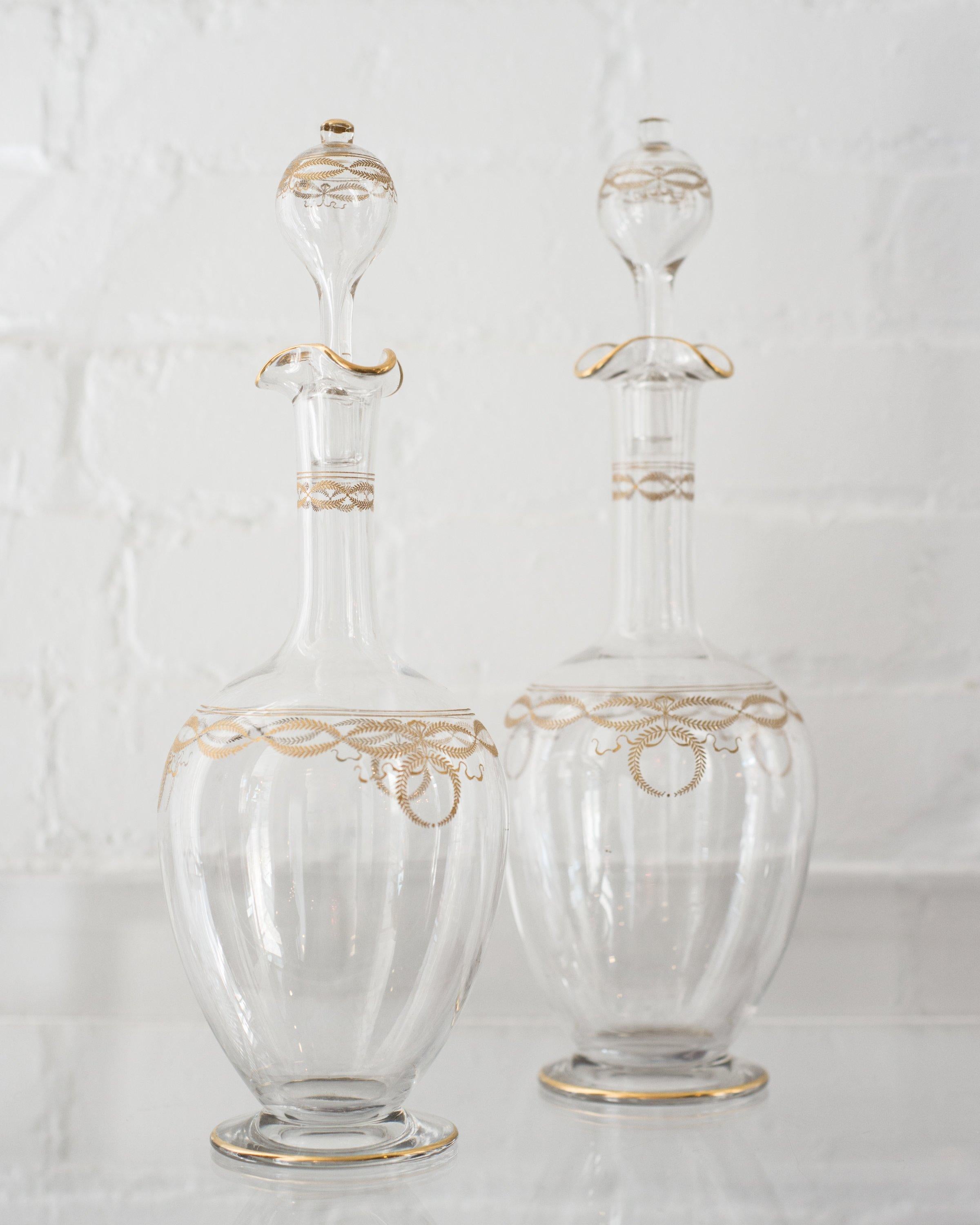 This antique Bohemian gold and glass decanter was originally used for wine. Ornately gilded with delicate wreathes around neck, body and stopper. Today it can be used to serve a wide variety of drinks such as orange juice or water.