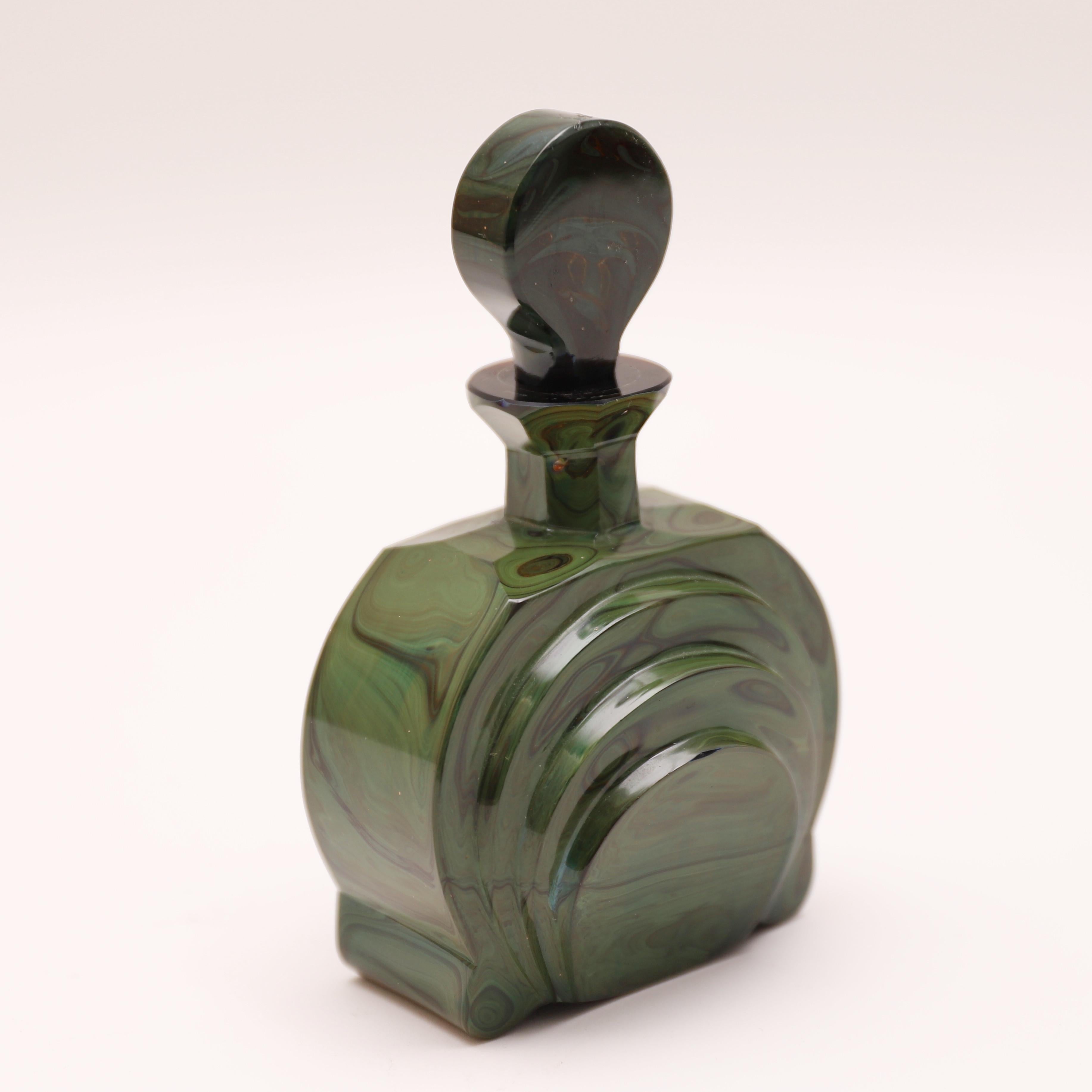 Bohemian Lithyalin Glass Perfume Bottle and Stopper, dark blue tint with emerald and olive green marbling, beautifully cut and polished.
Lithyalin Glass is an Opaque or Translucent Marbled Glass with a Surface Resembling Marble or Polished