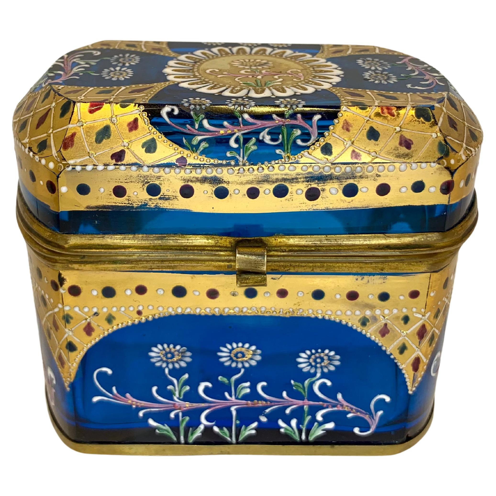 Fine Moser Casket Jewelry Box with Hinged Bronze Mounts

Lid and Base are Both Framed in Bronze

Hand-Painted all Around with 24k Gold and Colorful Enamel Decoration

Bohemia, Moser, 19th C.