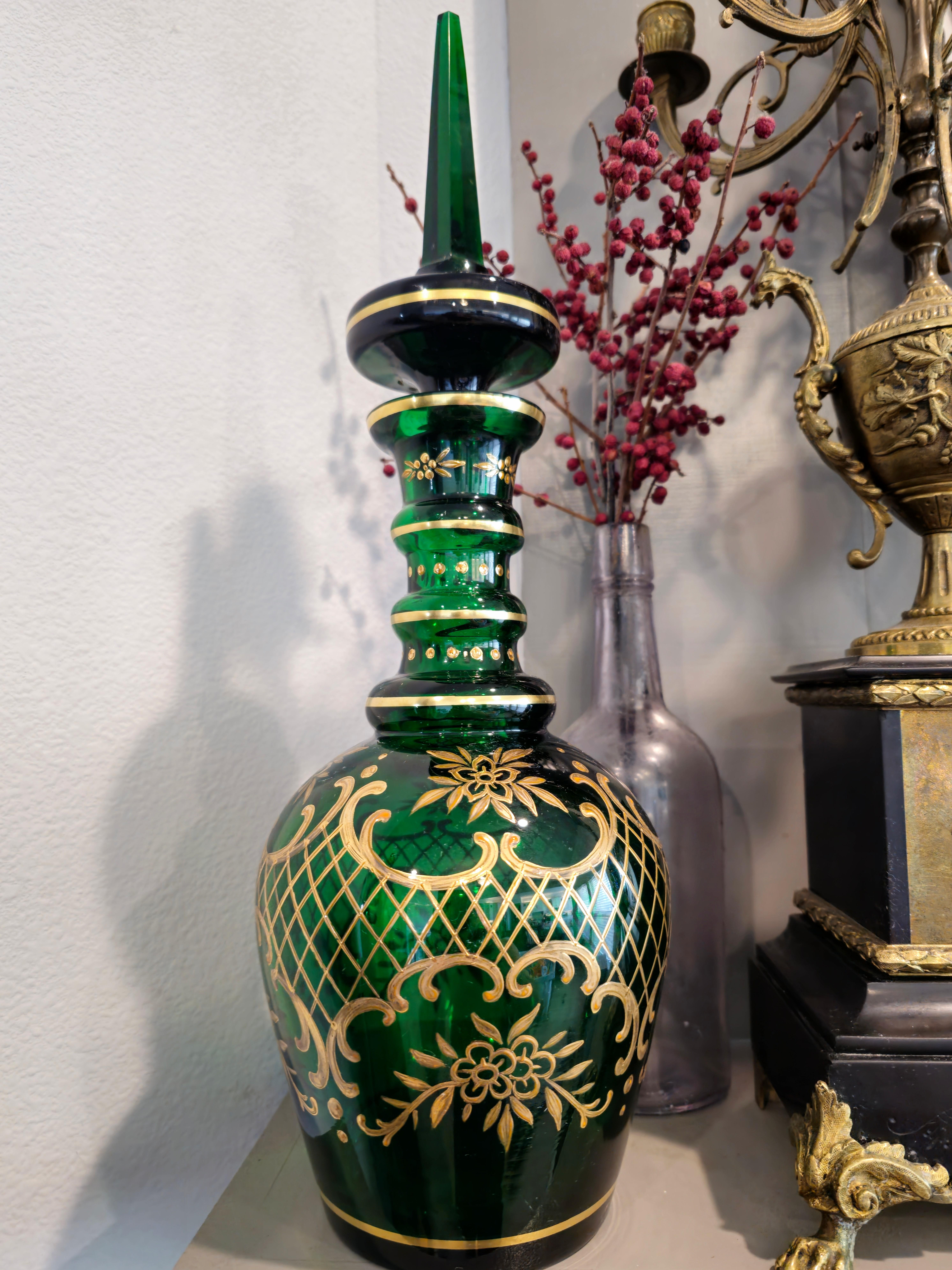 Add elegant warmth, sophistication, and deep rich color to any space with this stunning antique Moser Bohemian parcel gilt emerald green glass decanter. circa 1900

Born in Bohemia (present day Czech Republic) around the turn of the late 19th /