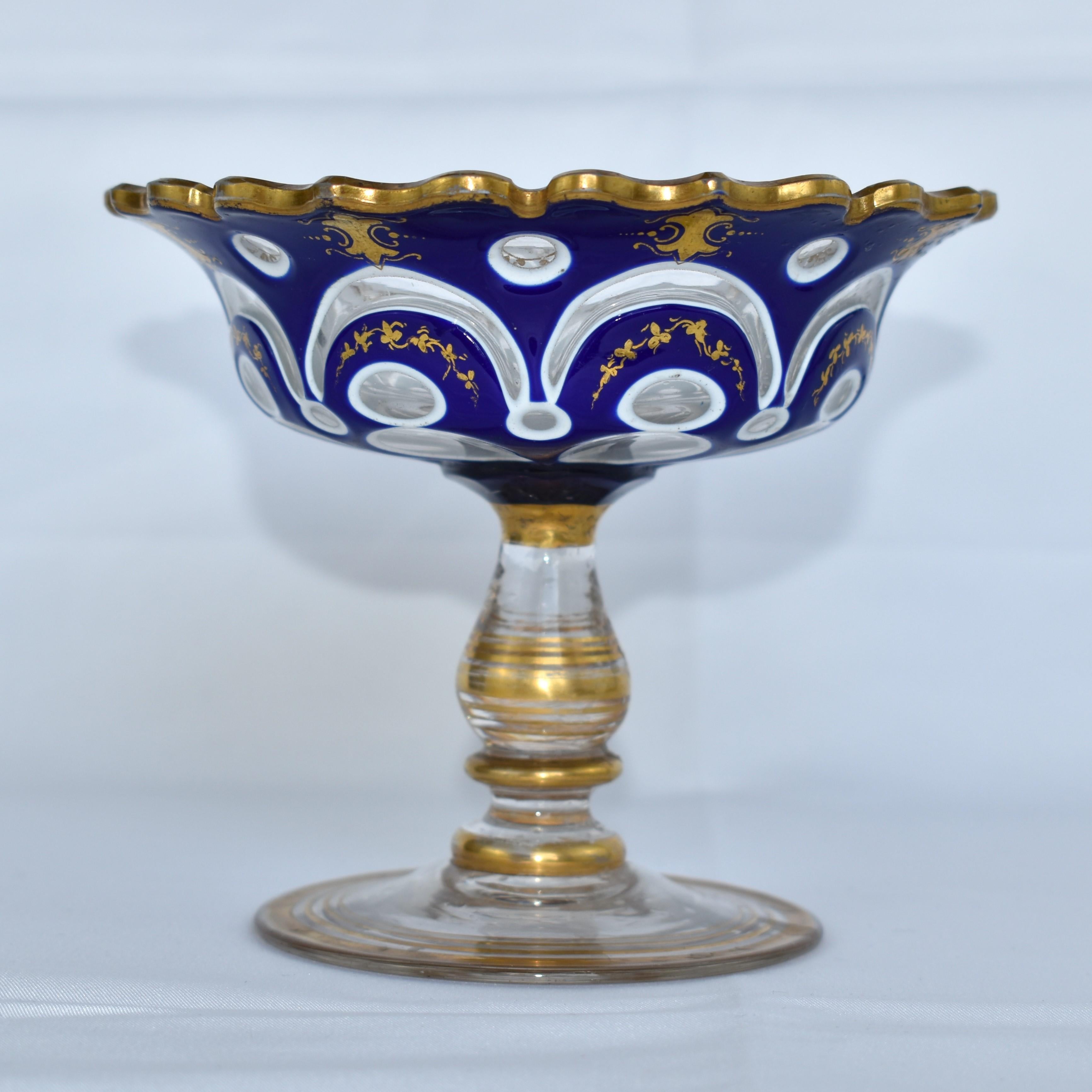Stunning Serving Bowl, Centerpiece by Moser

Clear Crystal Double Overlaid with White and Cobalt Blue Opaline Glass

Stunning Wavy Gilded Rim

Gilded Enamel Decoration and Gilding Highlights all around

Bohemia, circa 1880.