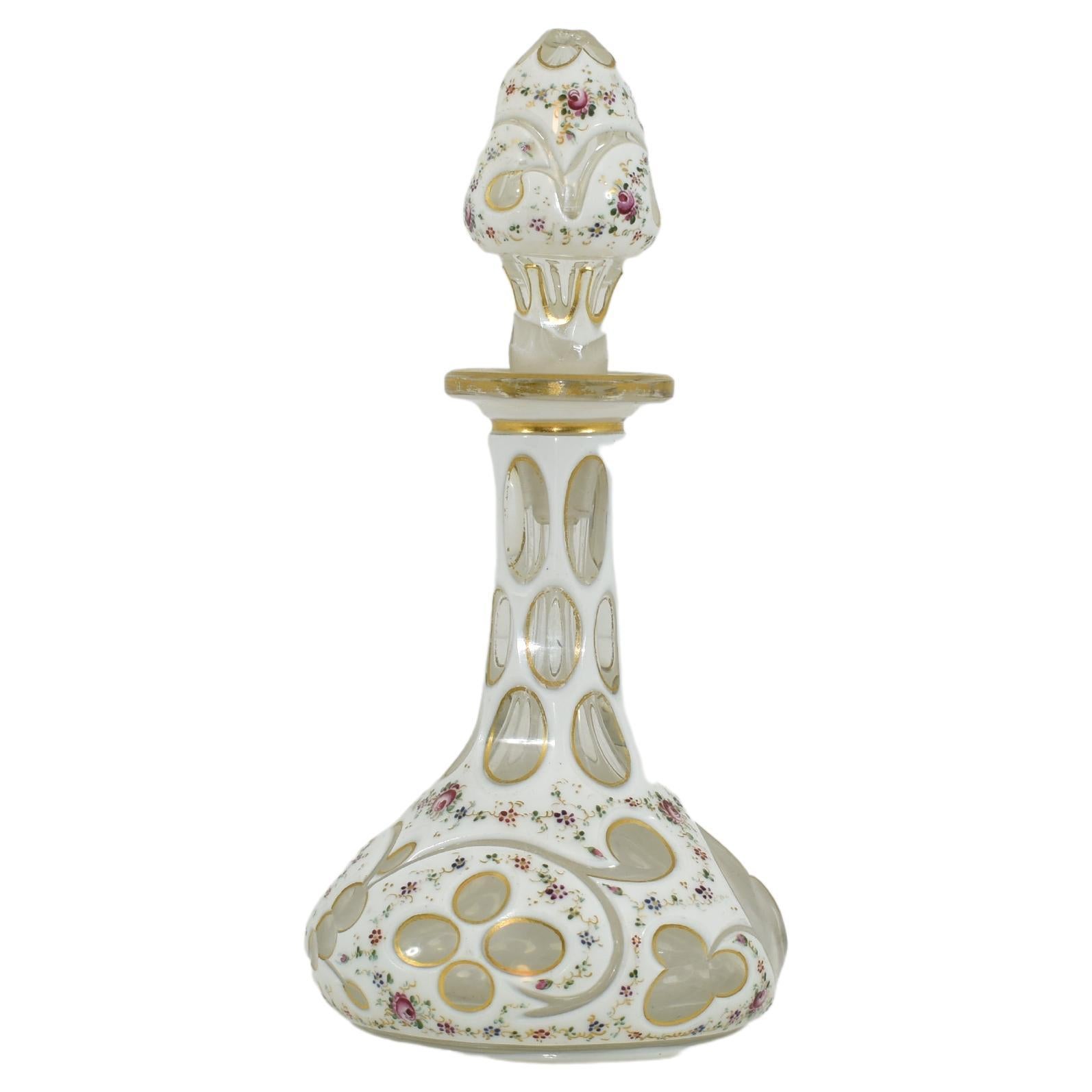 Antique perfume bottle with stopper
transparent glass with milky white cut opaline glass overlay
decorated all arround with clourful enamel
Bohemia, 19th century.