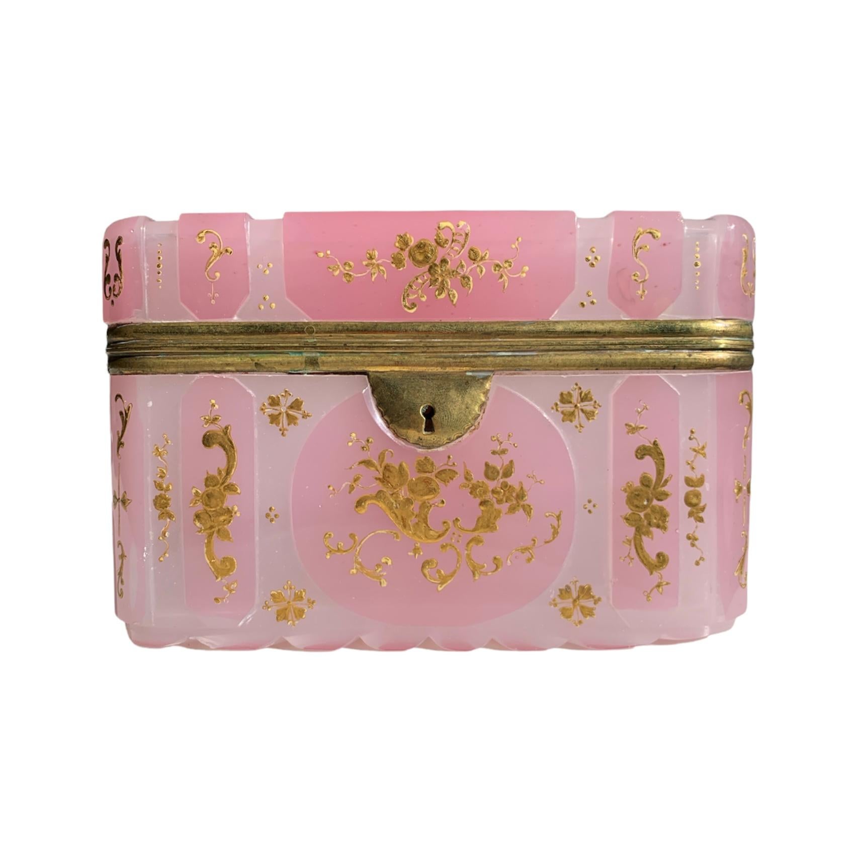 High-quality casket made of opal-alabaster overlay glass with metal mounts, cut and decorated all around with gilded enamel work, the white opaque glass is cased with a finely cut pink layer of opaque glass, all side panels are richly enameled with
