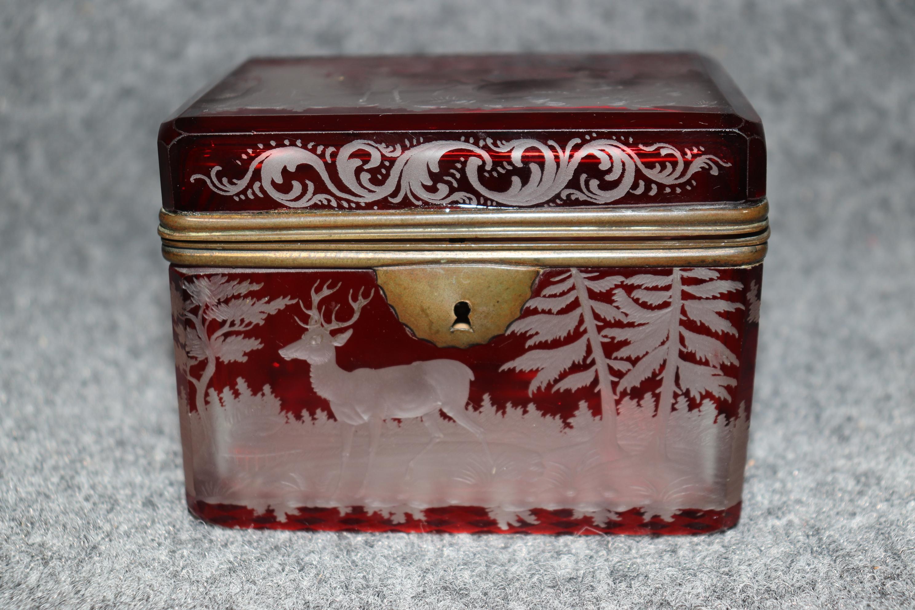 Dimensions - H: 3 1/2 in  W: 4 1/2 in D: 3 in

This antique 19th century Bohemian engraved crystal jewelry casket is made of the highest quality! Made in the 1890's, this petite jewelry box perfect for storing away any precious jewelry or small
