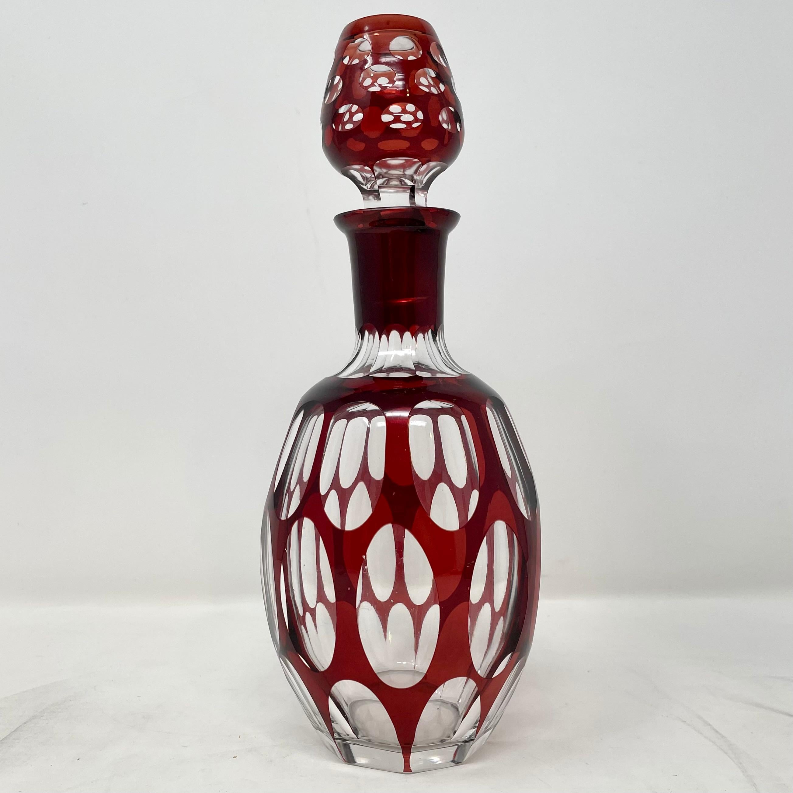 Antique Bohemian ruby crystal cut to clear decanter with 6 cordial glasses, circa 1900.
1 Decanter with Stopper: 9 1/2