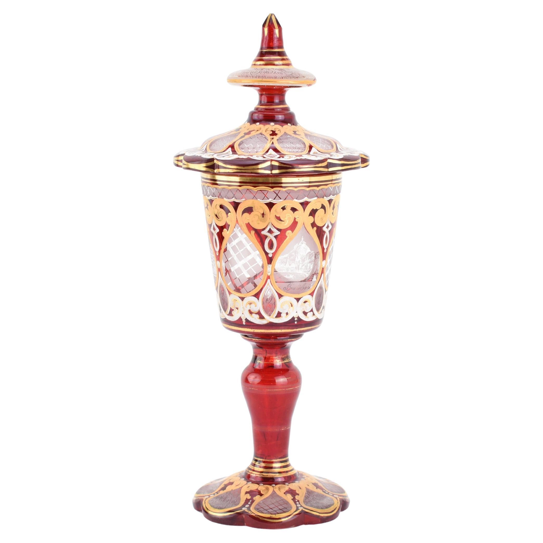 19th-Century Bohemian Ruby Red Cut Glass Covered Goblet
This beautiful 19th-century Bohemian ruby red cut glass goblet, complete with its matching lid, is a fine example of expert craftsmanship and design. Made from two-tone glass, the deep ruby red