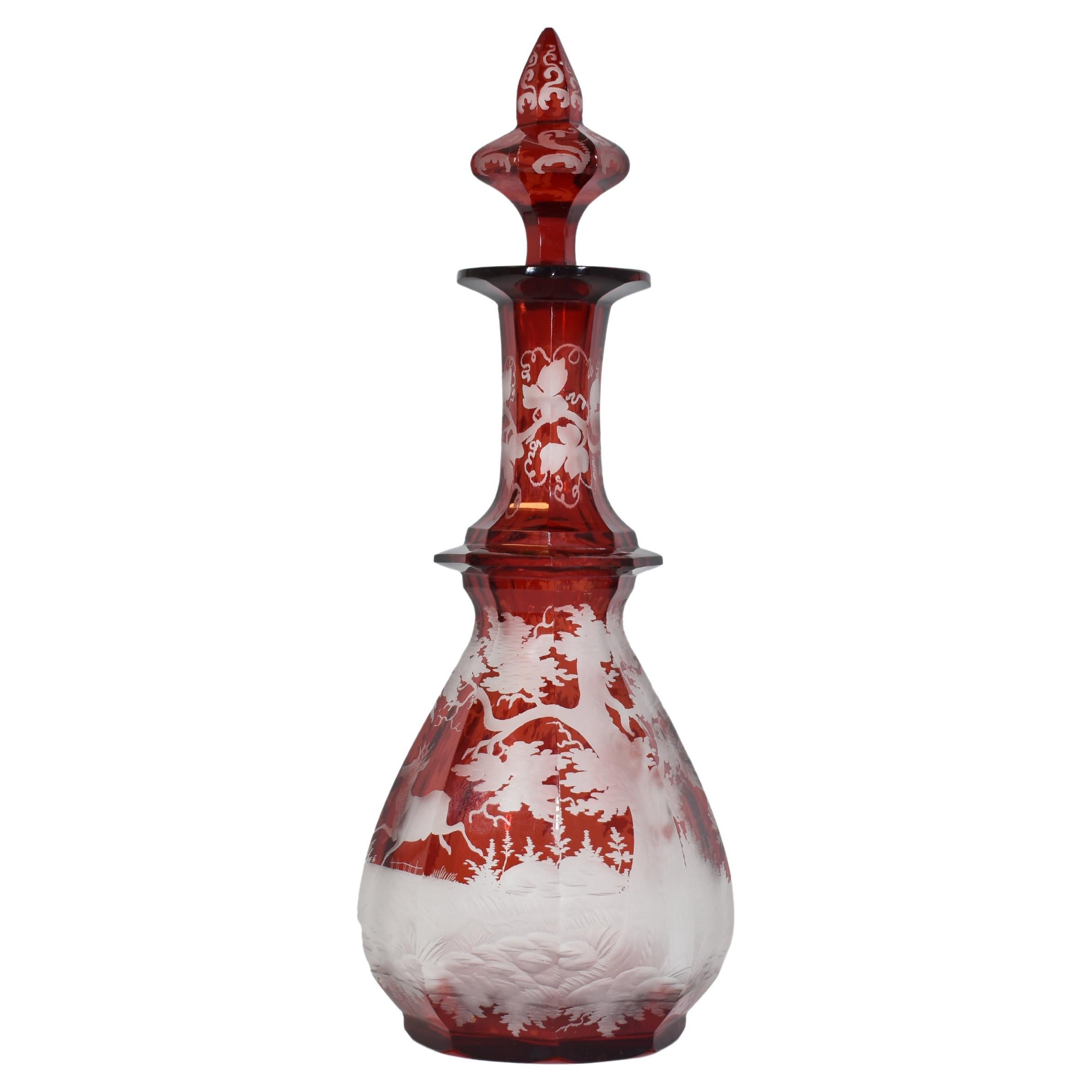 Rare ruby perfume bottle made of high quality Bohemian Cut glass with engraving work

continuous scene of a deer in the forest, further engravings on the neck and stopper

H. 23 cm
Bohemia, 19th century.