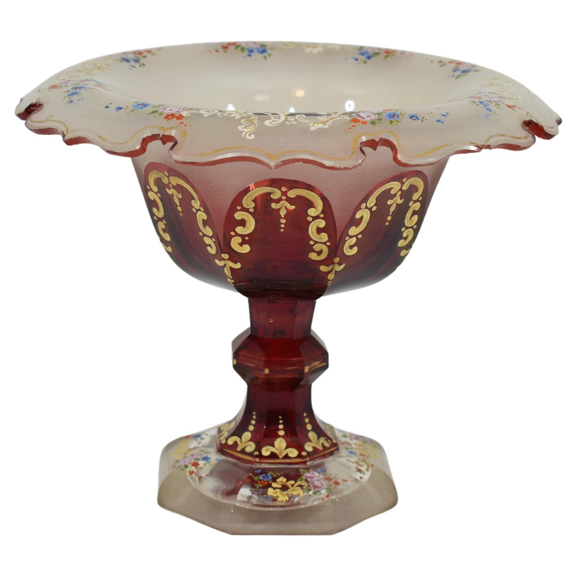 Tazza bowl made of opaque and ruby red glass.
Fine quality of the 19th century glass manufacture.
Hand-painted with gilded enamel decoration featuring scrolls and flowers
turned-out scalloped rim
Bohemia, 19th century.