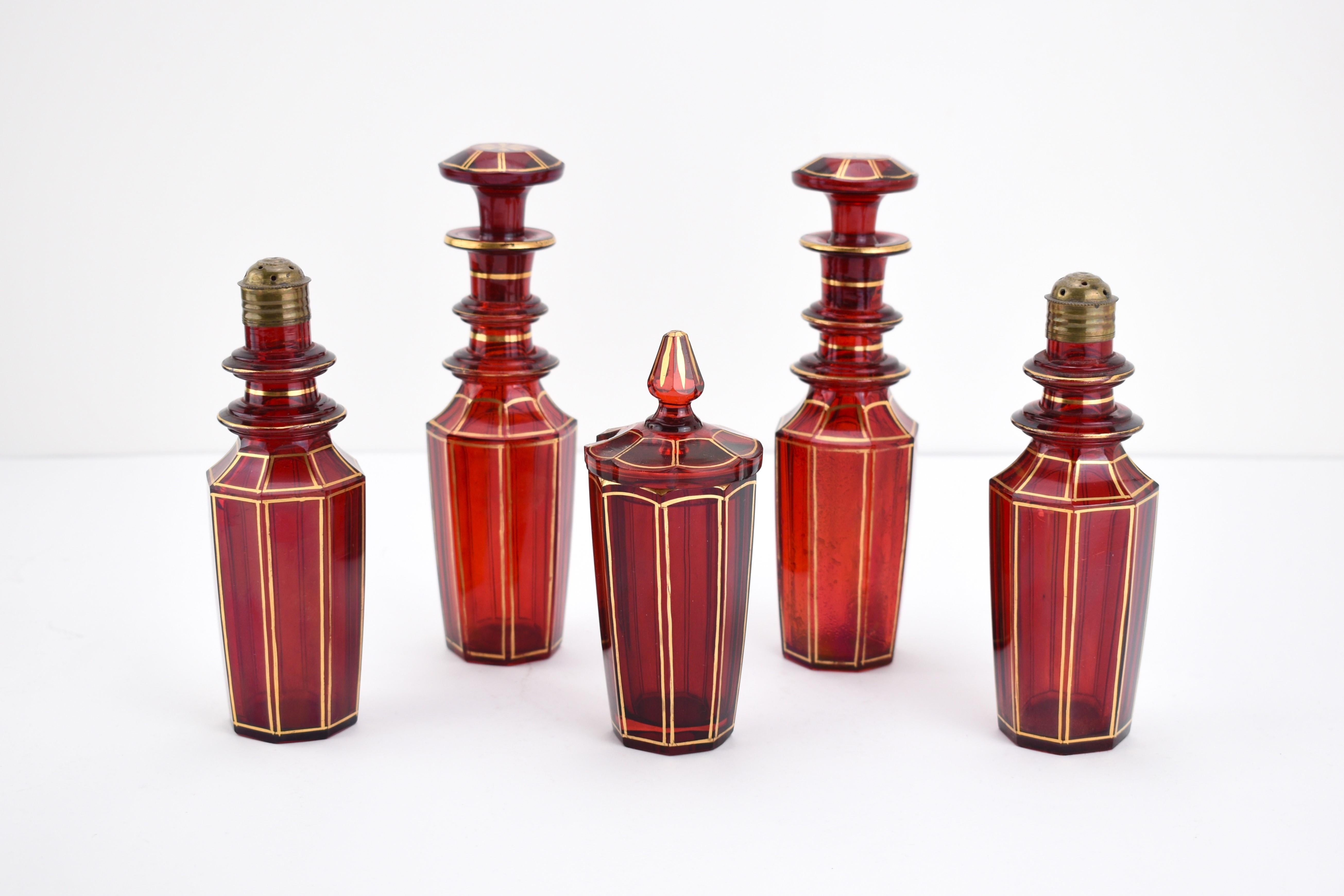 Antique Bohemian Ruby Red Crystal Glass 5-Piece Cruet Set – 19th Century
This elegant 5-piece Bohemian cruet set, crafted in the 19th century, is a fine example of the artistry and craftsmanship for which Bohemian glassmakers were renowned.

The set