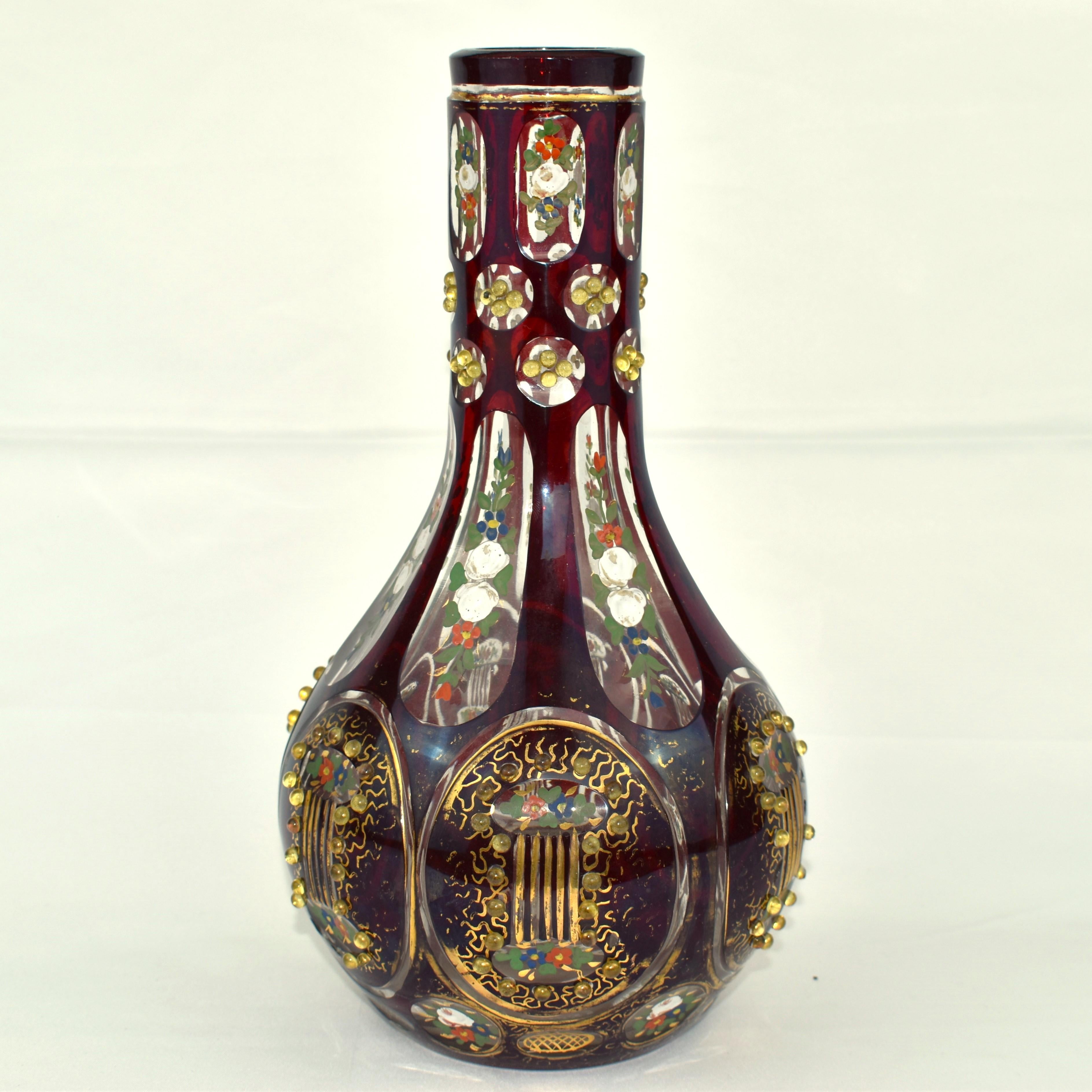 A Beautiful Bohemian Ruby Red Hookah Vase

Overlaid Cut-Glass

Decorated with Jewel Beads and Gilded Enamel

Made for the Ottoman Market in the Early 19th Century

Bohemia, Circa 1840