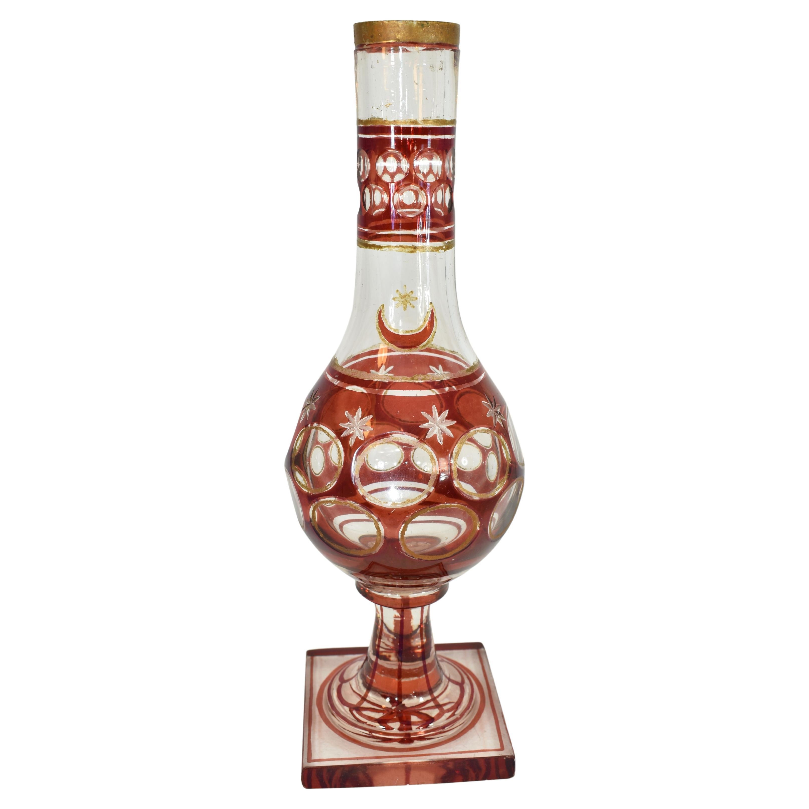 Large Bohemian turkish Islamic Hookah Base
clear and ruby red glass
cut in star shape at the bottom
Bohemia, 19th Century
Stands 32 cm high 