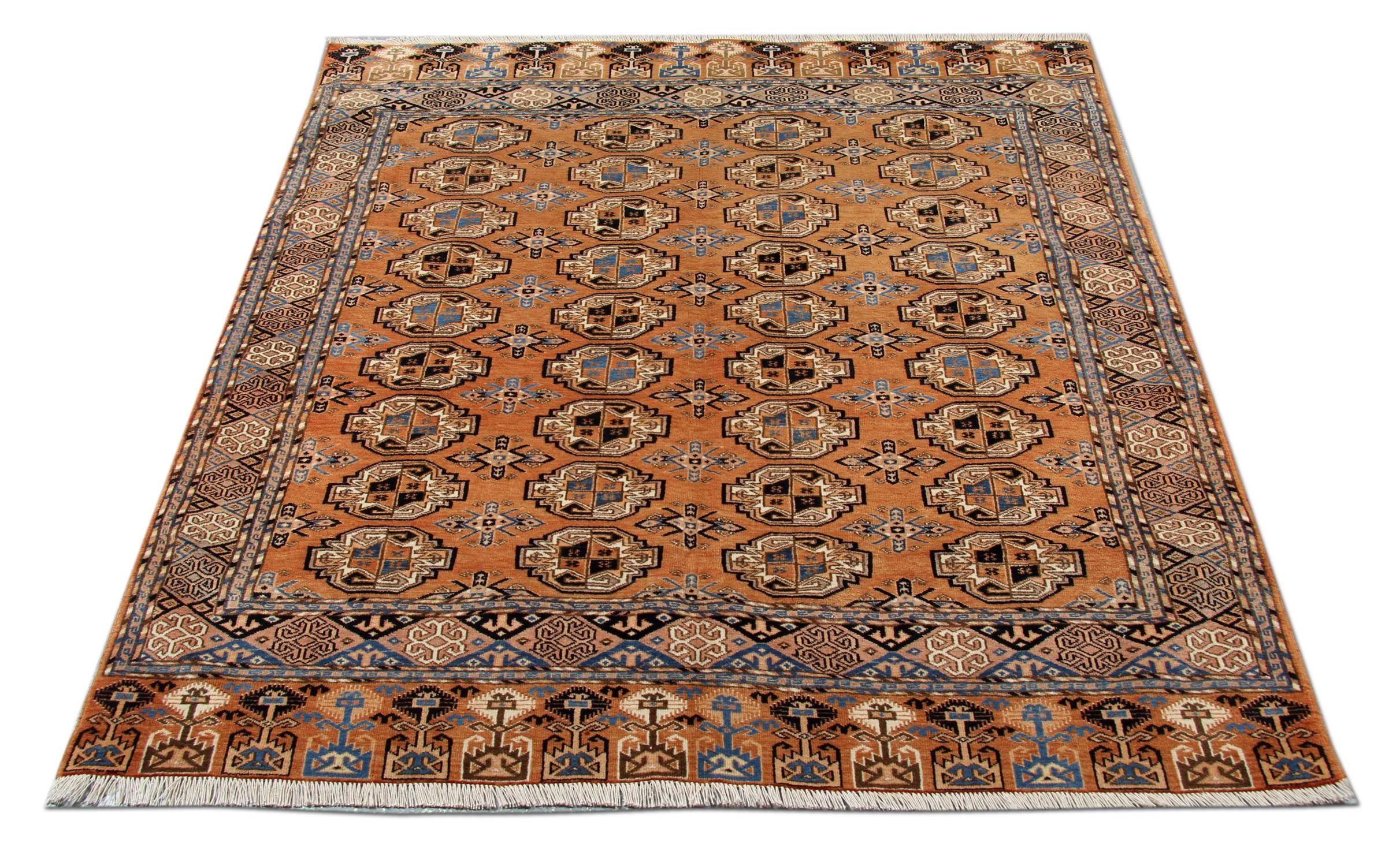 A Bokhara rug from the Caucasus region of the early 20th century with geometric gulls and polygons with a brick red background and shades of blue and beige. Tribal motifs with Classic borders.
Handmade carpet Oriental rug minimal colours have been