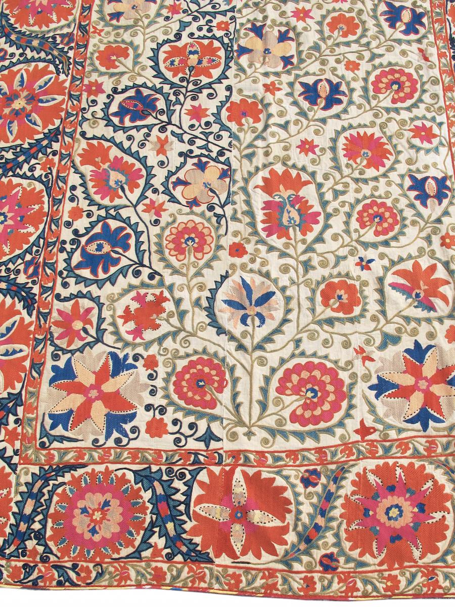 Antique Bokhara Suzani Rug, 19th Century

Woven in the vicinity of the ancient Central Asian city of Bukhara this Suzani is densely decorated with a magical and organic array of blossoms and tendrils embroidered in vivid silk floss. A veritable
