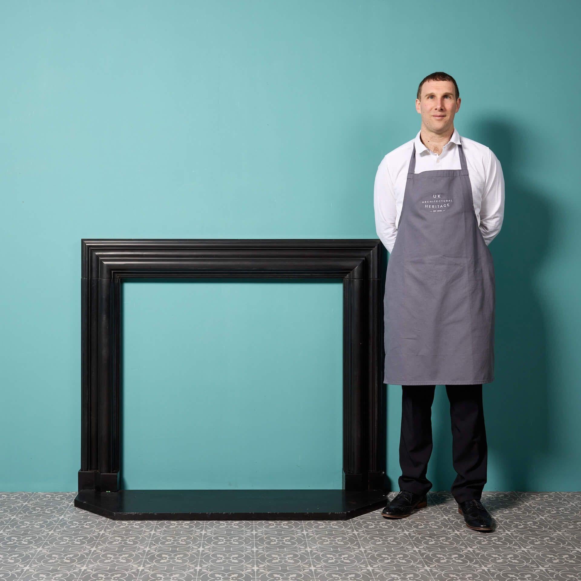 An antique bolection marble fire surround. This striking Belgian black marble fireplace was reclaimed from a large house in North London.

The marble is of beautiful quality, showcasing the deep black, instilling any space with elegance and