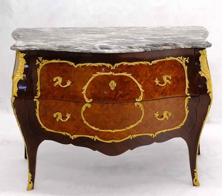 Very fine mint condition antique French bronze ormolu mounted marble top commode dresser chest of drawers. Stunning super clean condition. Beautiful exotic woods marquetry work. Nice grey and white pattern marble top.