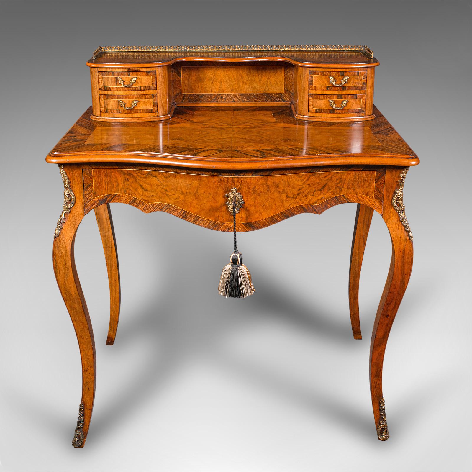 This is an antique bonheur du jour. A French, walnut ladies writing desk, dating to the late Victorian period, circa 1900.

Sumptuous colour and delightful figuring to this fine desk
Displays a desirable aged patina and in good order
Walnut and Burr