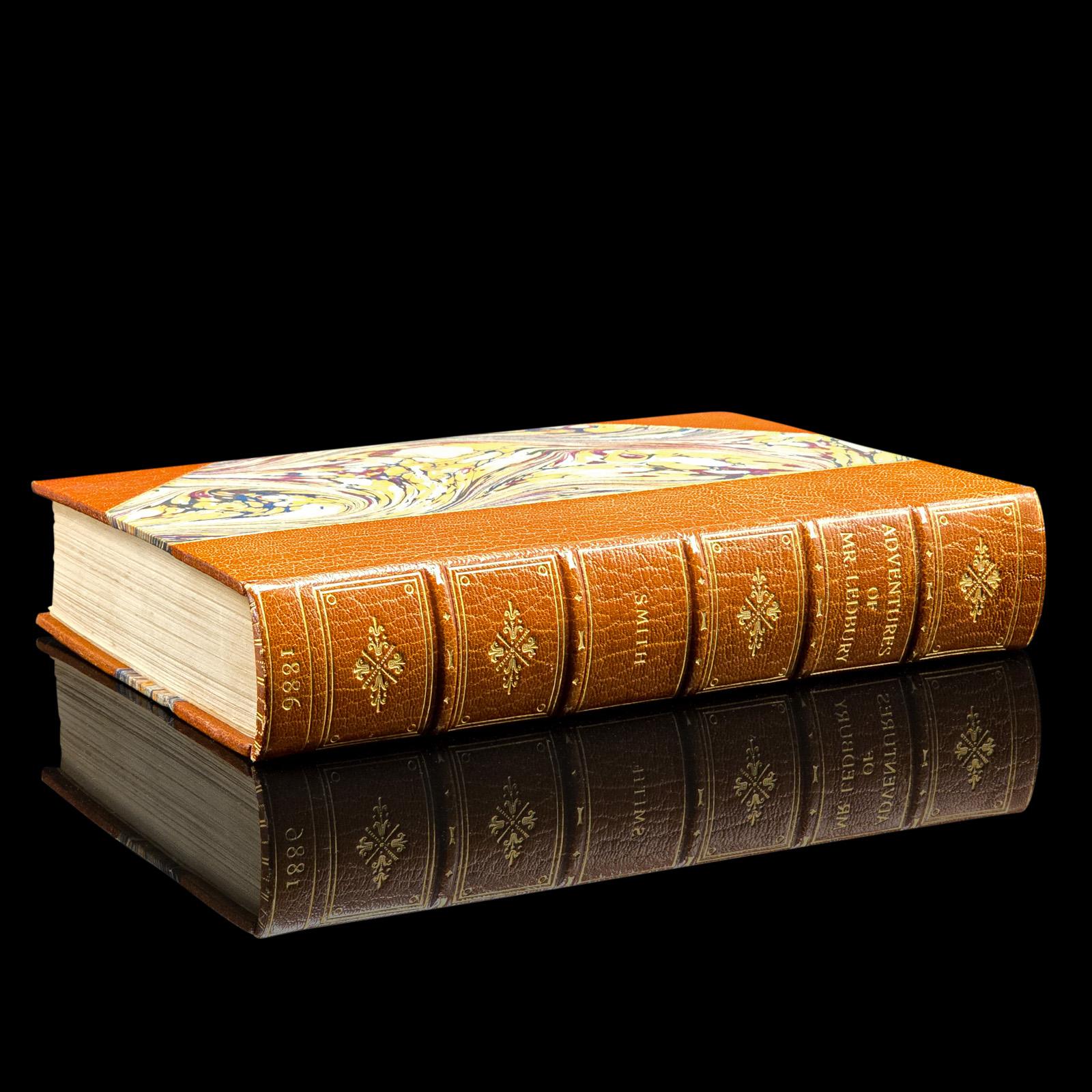 This is an antique copy of Adventures of Mr Ledbury by Albert Smith, a humorous novel exploring themes of culture and travel. Presented in intact order with light markings, the book has been given a later professional binding, offering both