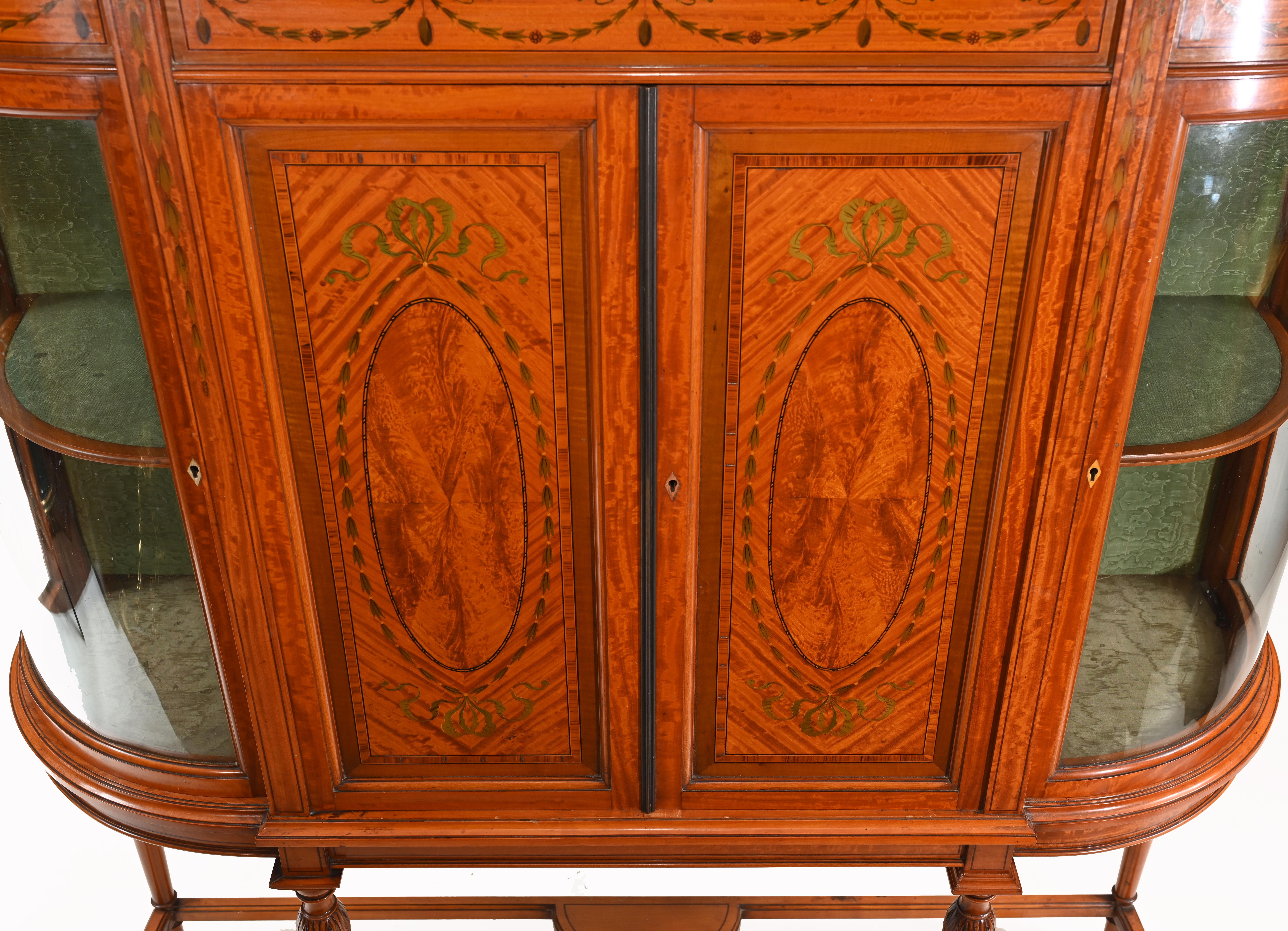 Extremely handsome antique bookcase or cabinet in satinwood
Piece is stamped by makers Maple & Co (please see close up photo)
Maple & Co. was a British furniture and upholstery manufacturer established in 1841 which found particular success during