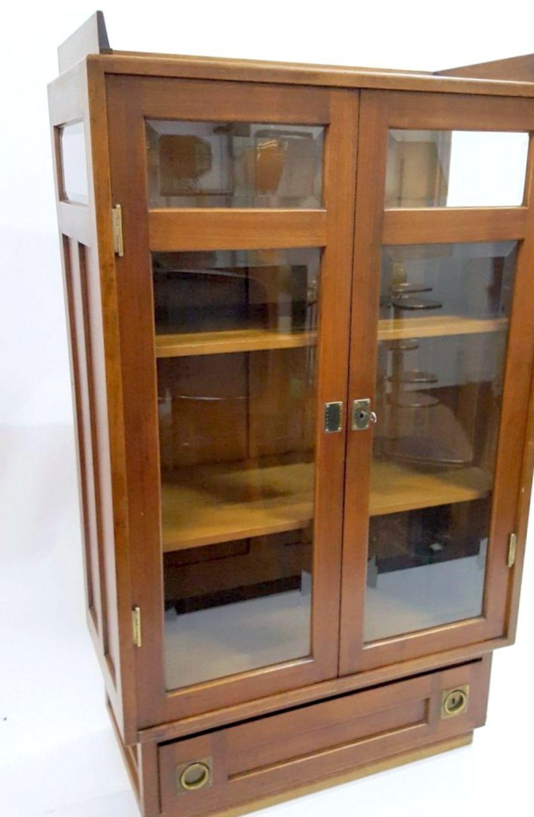This rare, turn of the century bookcase, is made in the manner of Adolph Loos, from Austria, by Erstes Wiener Möbelheim. Adjustable shelfes, and extraordinary cut glass and woodwork, are the features of this bookcase. With some damage on the top,