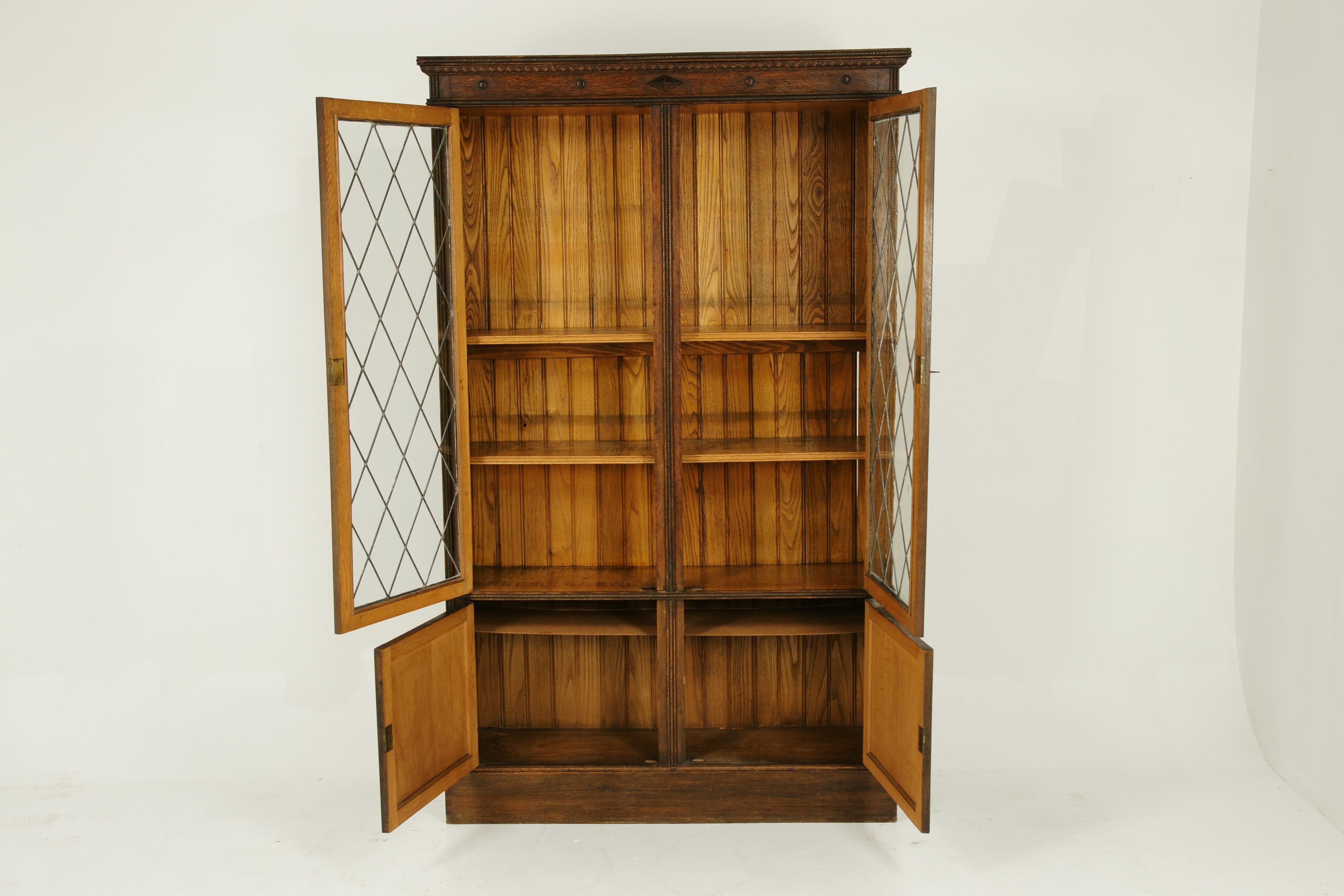 Antique bookcase, leaded glass bookcase, display cabinet, Arts & Crafts, scotland 1910, Antique Furniture, B1356, 

Scotland, 1910
Solid oak construction
Original Finish
Carved cornice above
Pair of tall original leaded glass doors
Open to reveal