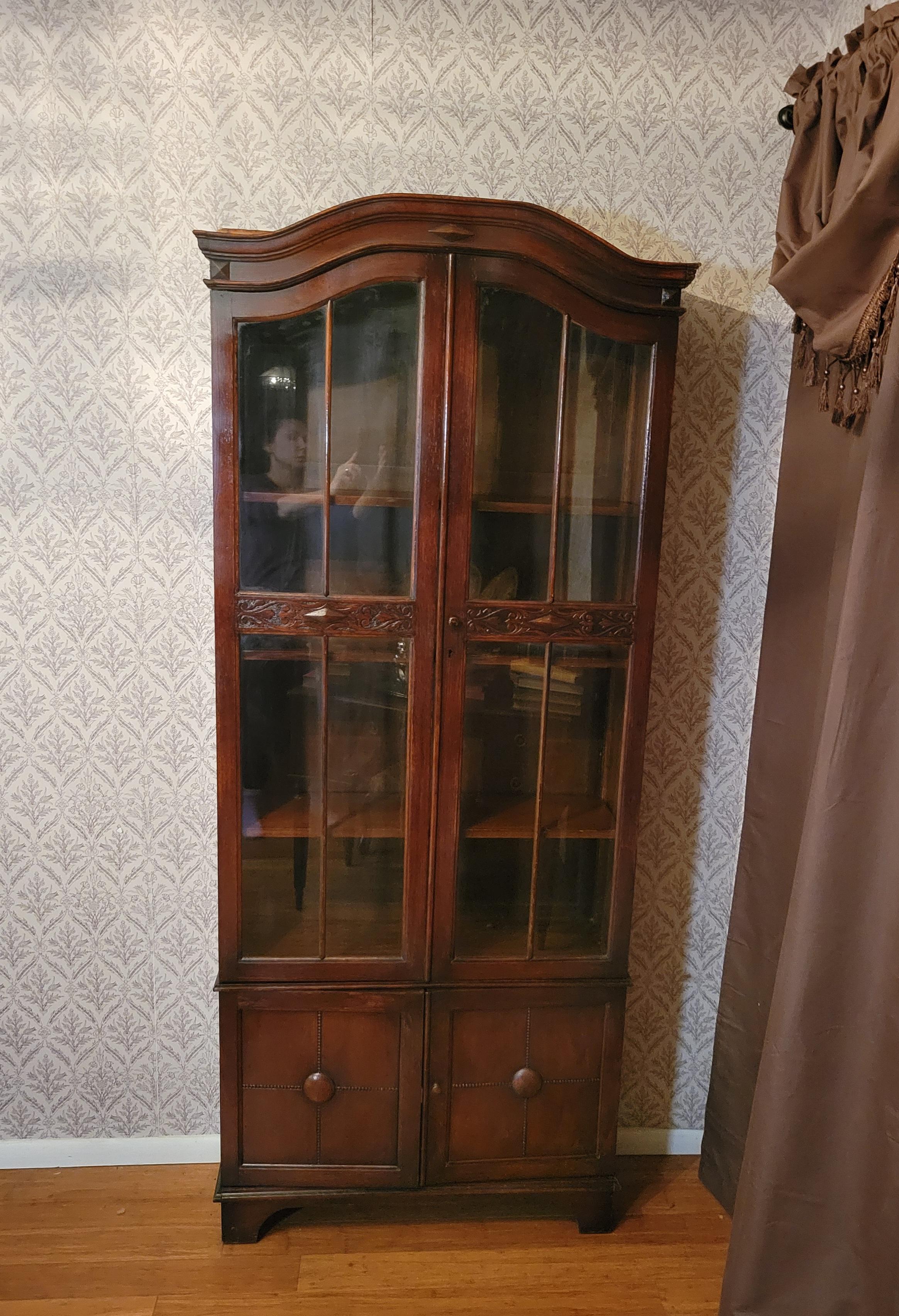 Antique bookcase with (2) glass doors and bottom compartment: 75