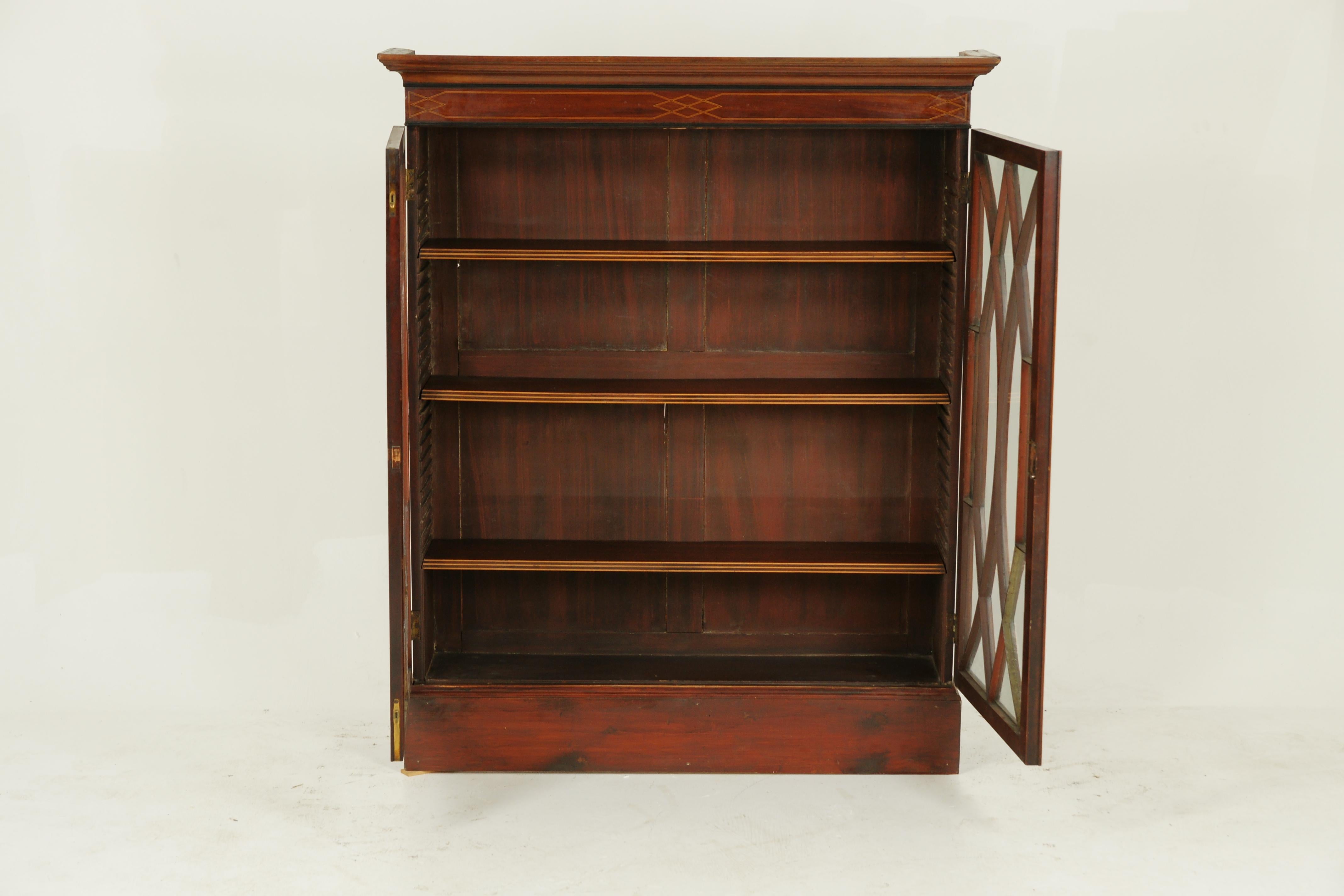 Antique bookcase, inlaid bookcase, display cabinet, Scotland 1910, antique furniture

Scotland, 1910
Solid walnut and satinwood
Rectangular top with inlaid frieze
Pair of inlaid original glass doors
Three inlaid adjustable slide in