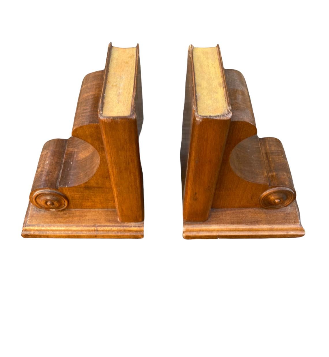 Antique wooden book ends with academic motif. Featuring book and scroll design. Health line underneath to prevent scratching on many surfaces.