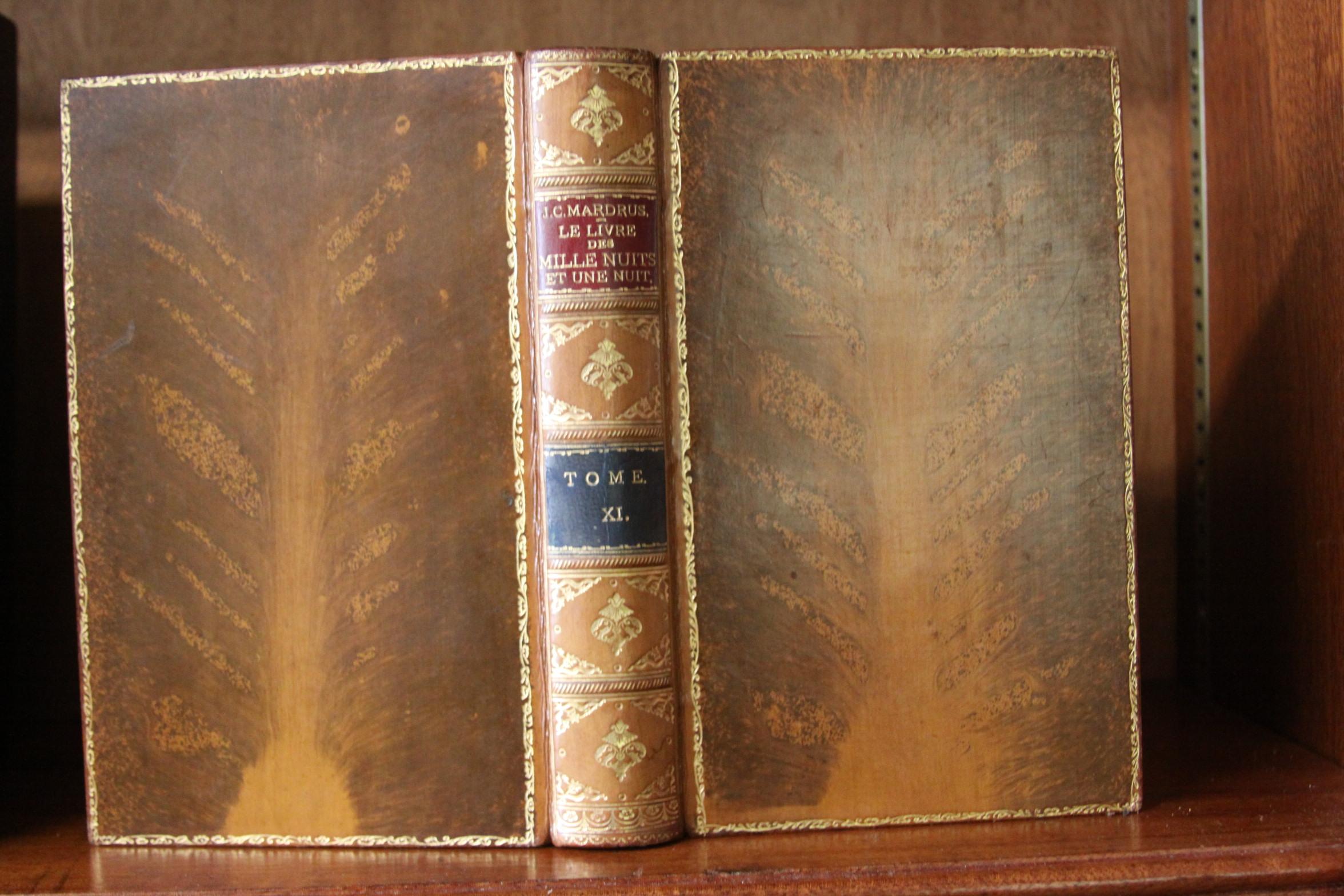 Antique books. Sixteen volumes. Arabian Nights ( French Text) Le Livre Des Millie Nuits Et Une Nuits. Published: Paris Charpentier Et, Eugene Fasquelle Edituer 1903. Bound in full tan polished three calf binding, gilt decorative spine, maroon and