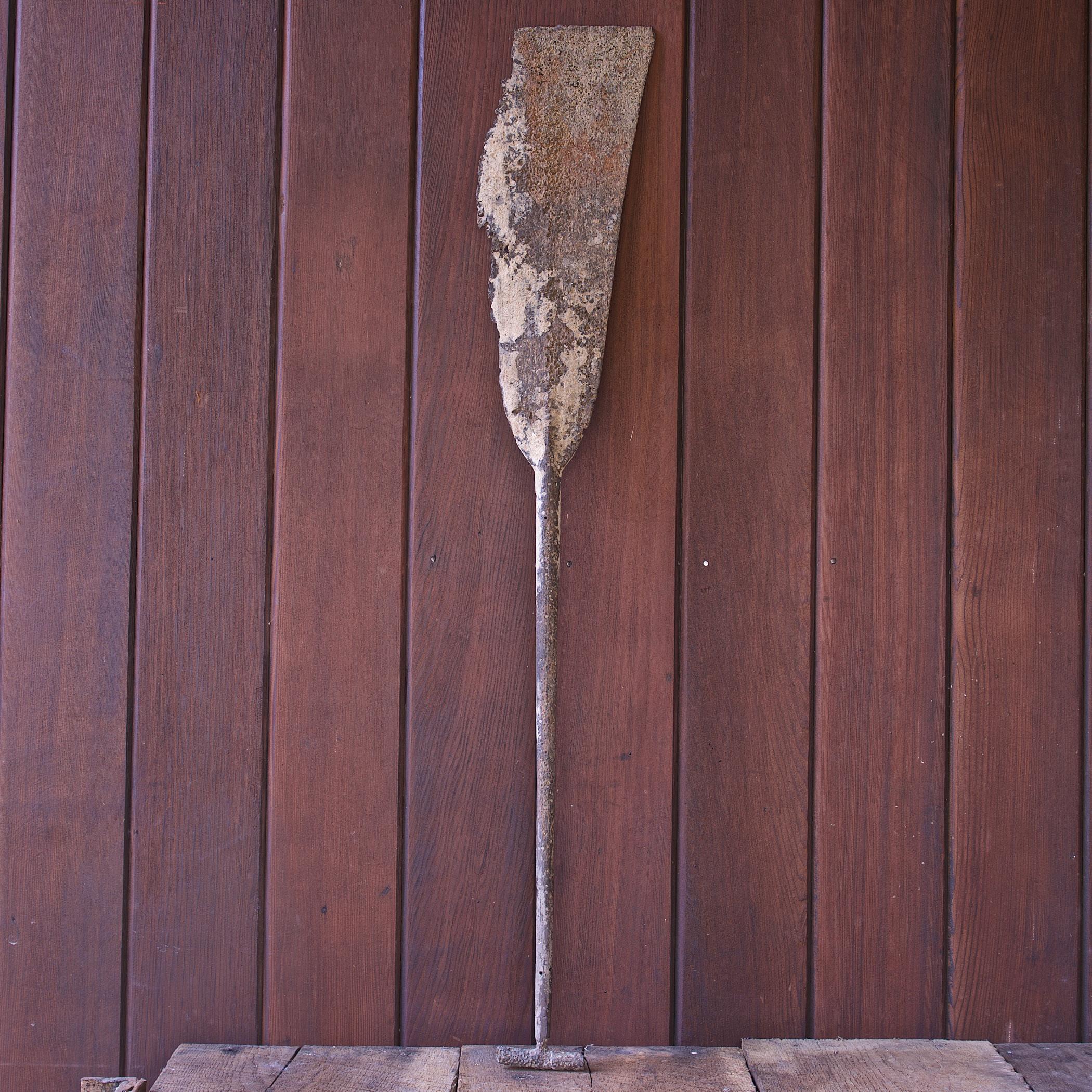 Antique ocean salvage Dayak Ironwood canoe paddle from East Kalimantan, Borneo. Carved from one piece of Ironwood, Kayu Belian, a very hard dense wood. This paddle takes weeks to make by hand. Also called a wedding paddle. It is tradition that the