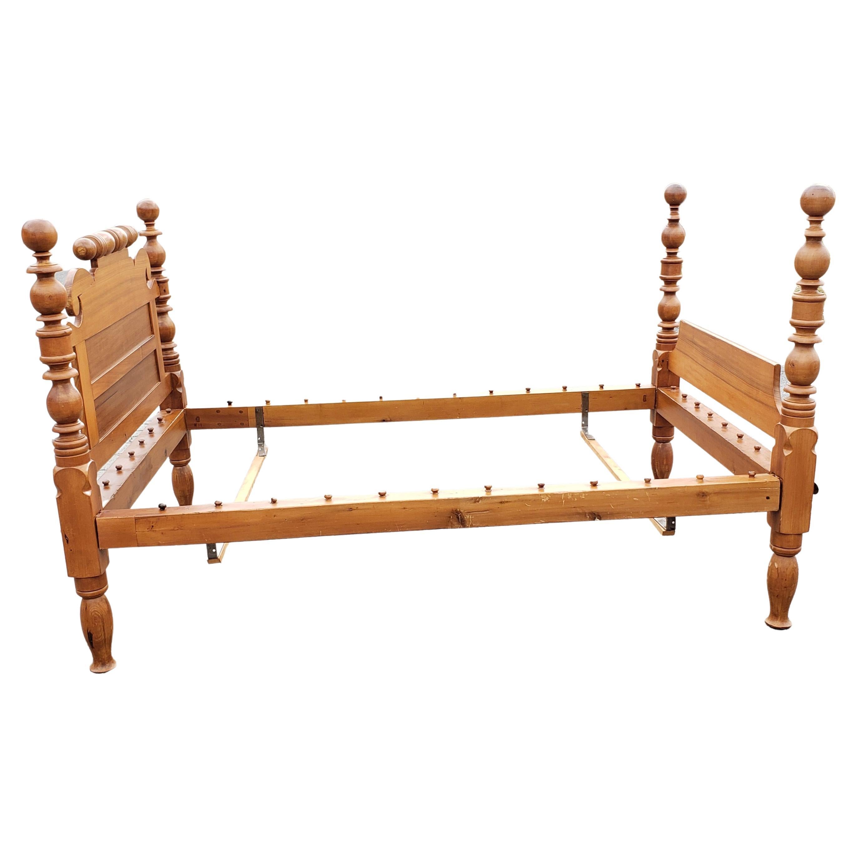 Early 1800’s Sheraton rope bed, probably Boston, with a turned posters headboard and footboard. All hand made and hand turned by a master craftsman, it has heavy solid construction. The solid maple frame has a beautiful warm patina, making it a