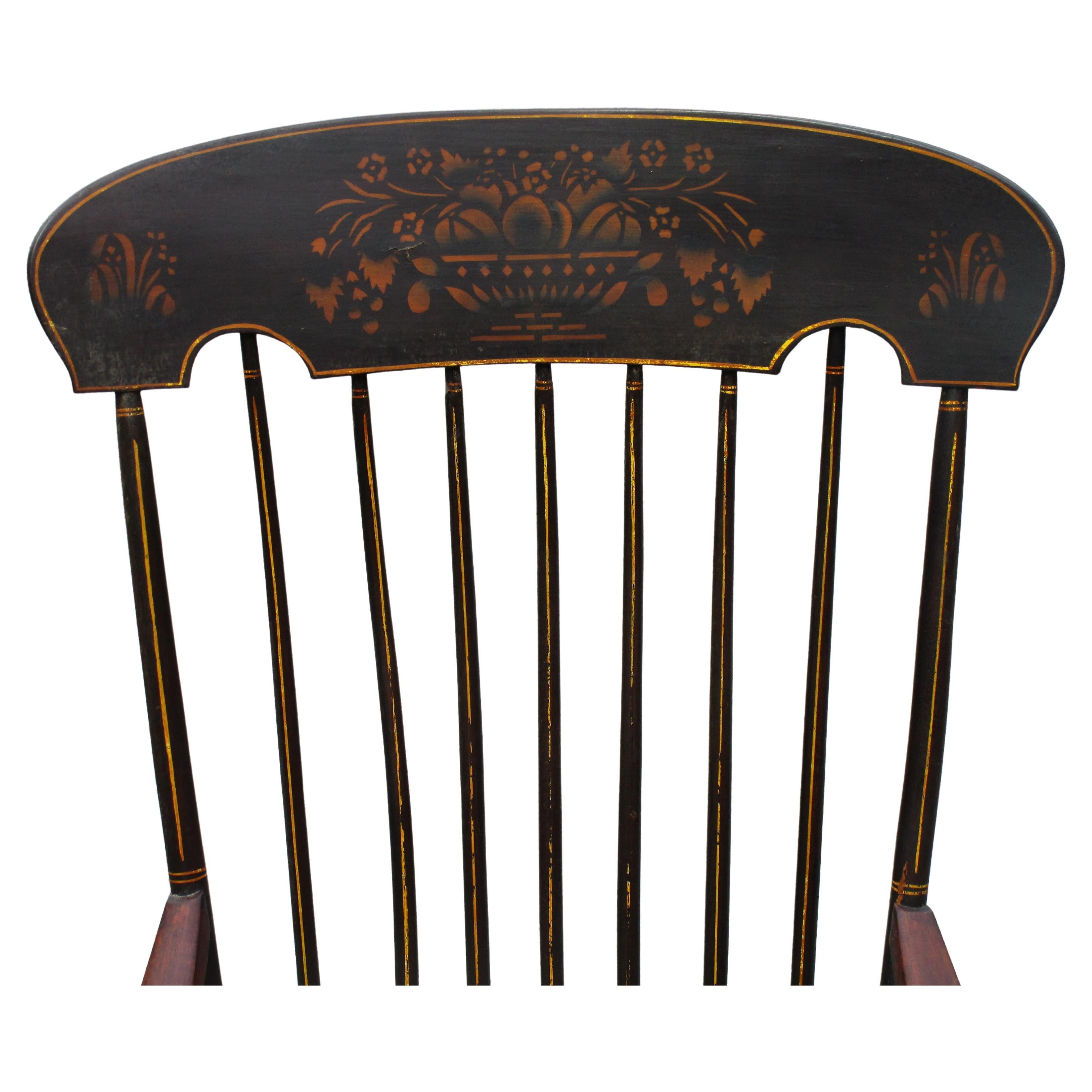 Antique American Boston rocking chair in all original antique condition w/ black painted surface, stenciled flower basket decoration at back crest, stenciled flower decoration front of seat, gilded pinstriping. Pencil signed on underside of seat (
