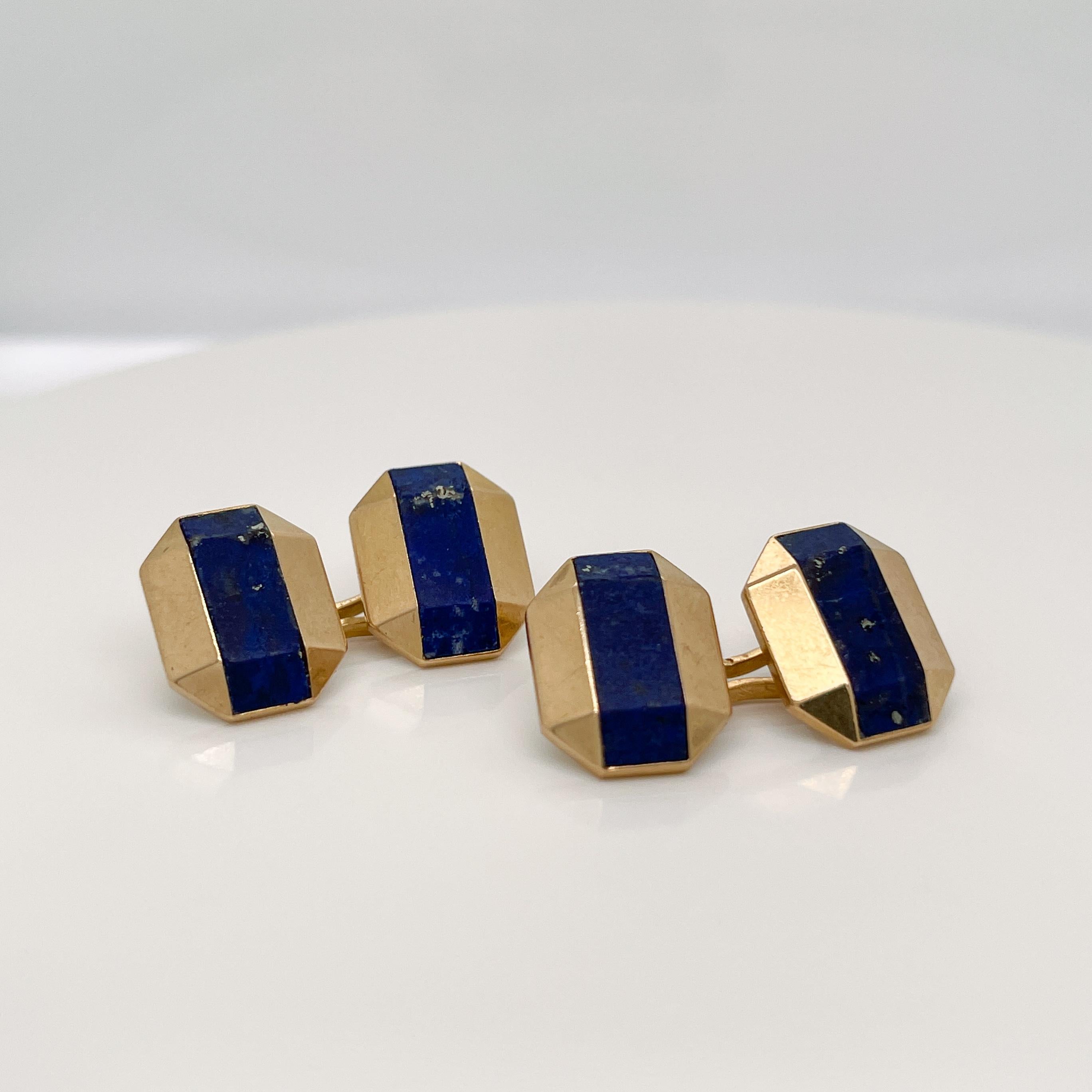 A fine pair of antique Art Deco cufflinks.

By Boucheron.

In 18k gold.

Each with octagonal, faceted gold heads with lapis inlay and linked with figure-8 links.

Marked with French hallmarks and one with an etched 'Boucheron Paris' to the reverse