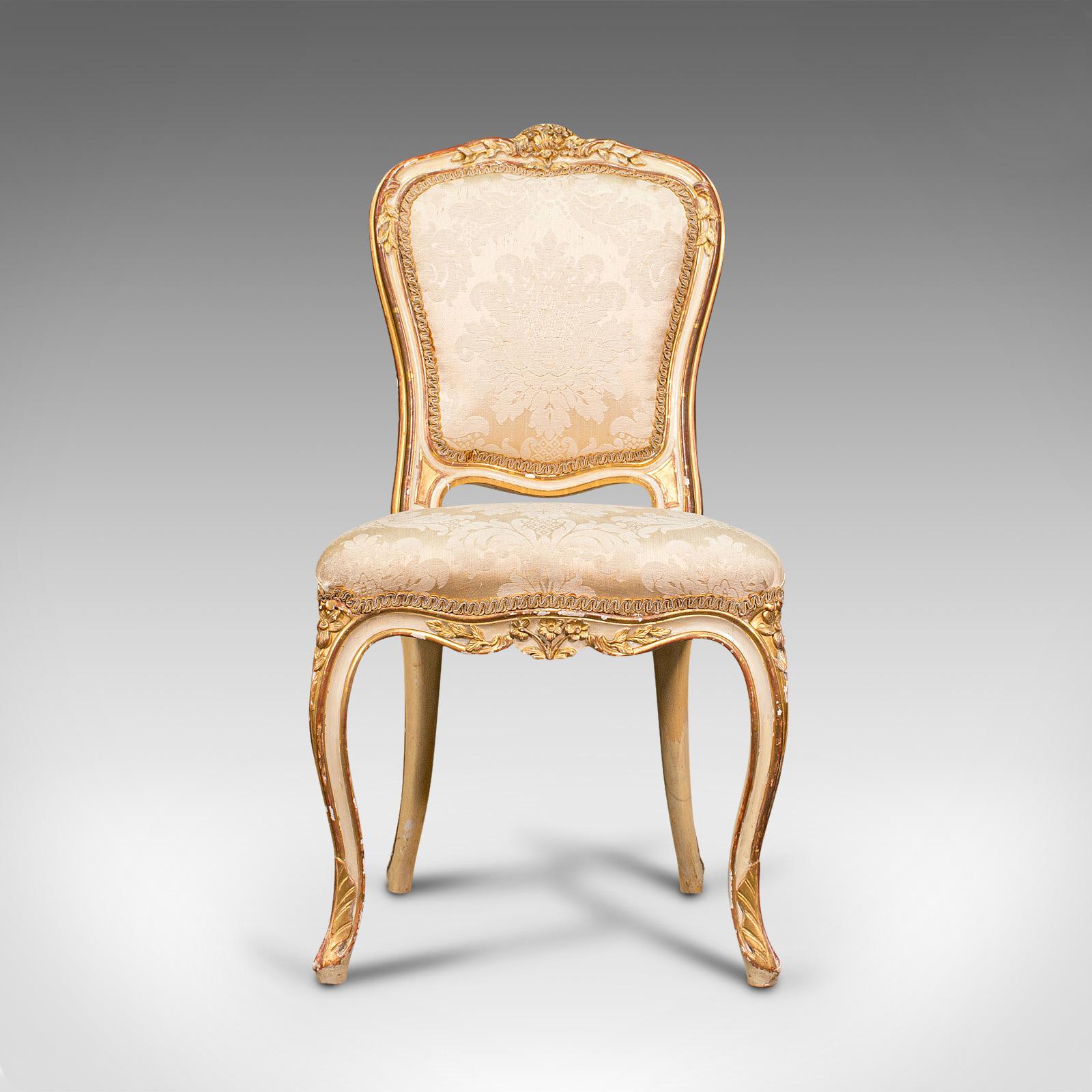 This is an antique boudoir chair. A French, giltwood and silk cotton bedroom dressing seat, dating to the Victorian period, circa 1900.

Beautiful small chair set to grace any room
Displays a desirable aged patina, some marks commensurate with