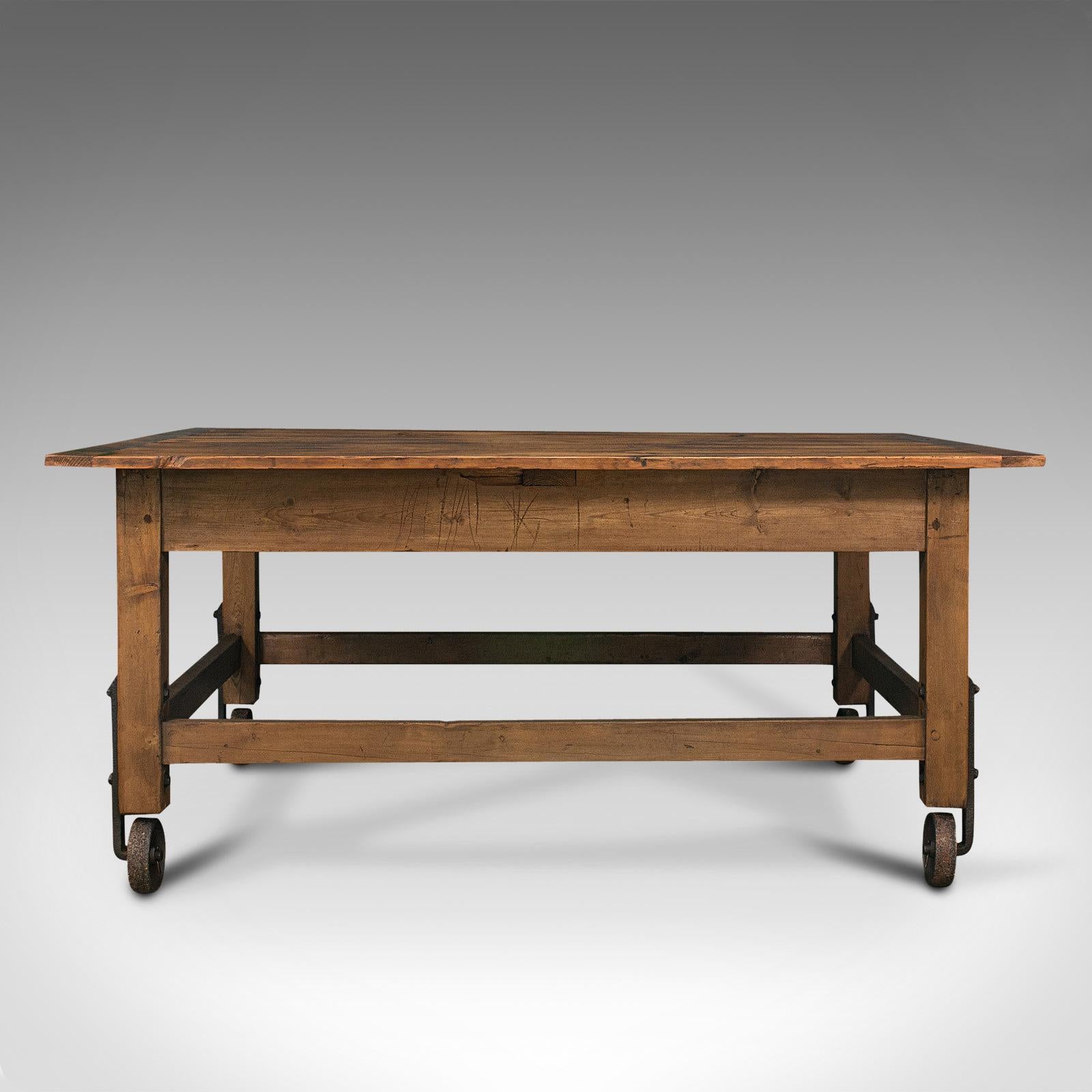 This is an antique boulangerie table. A French, pine shop or bakery display table, dating to the late Victorian period, circa 1880.

Delightful, rolling table for presenting artisan produce or items
Displaying a desirably aged patina