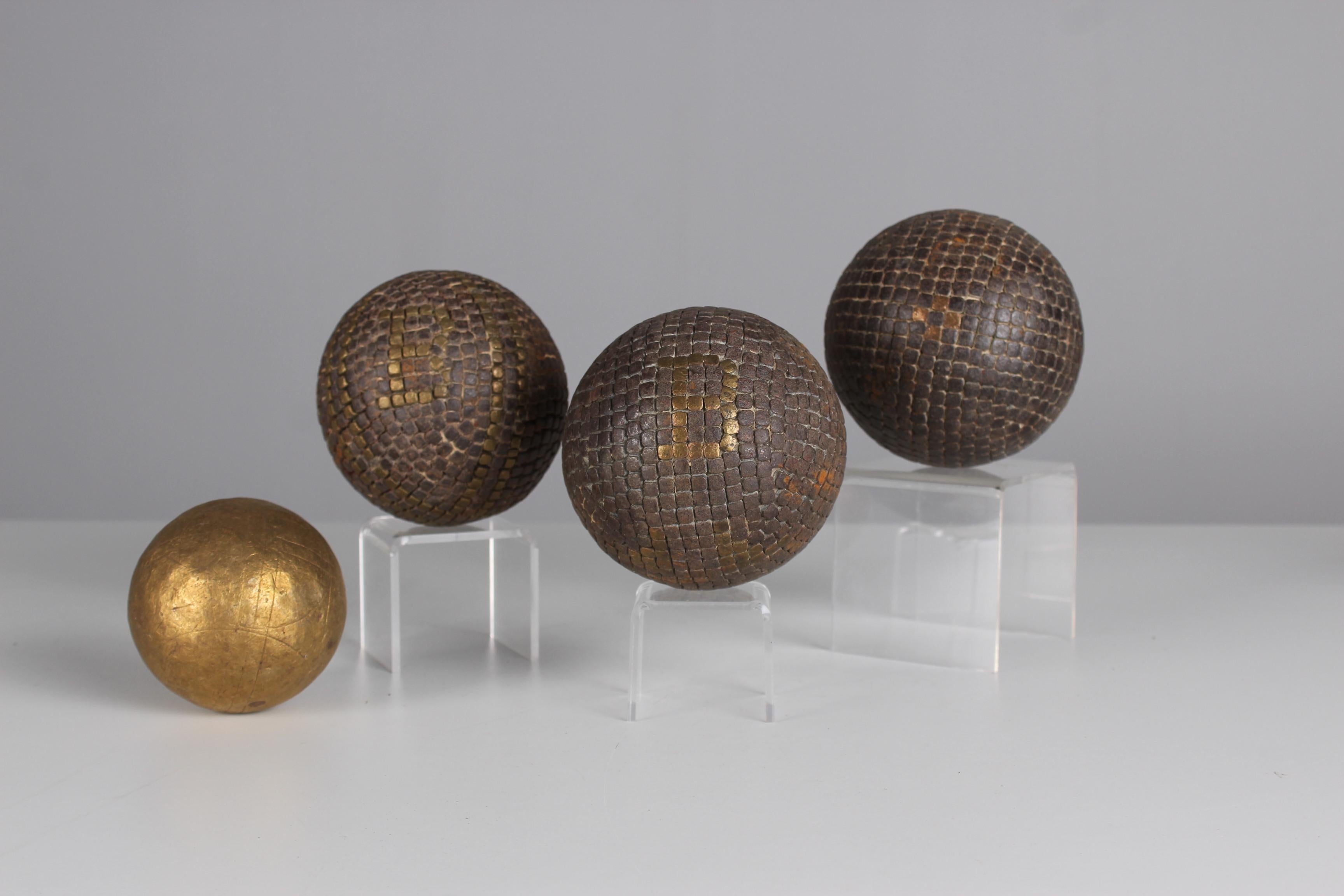 Beautiful, unique Boule set of three Boule balls and one target ball, France, late 19th century.

In the 19th century, the manufacture of boules balls underwent significant development in France as the game of boules, particularly the pétanque