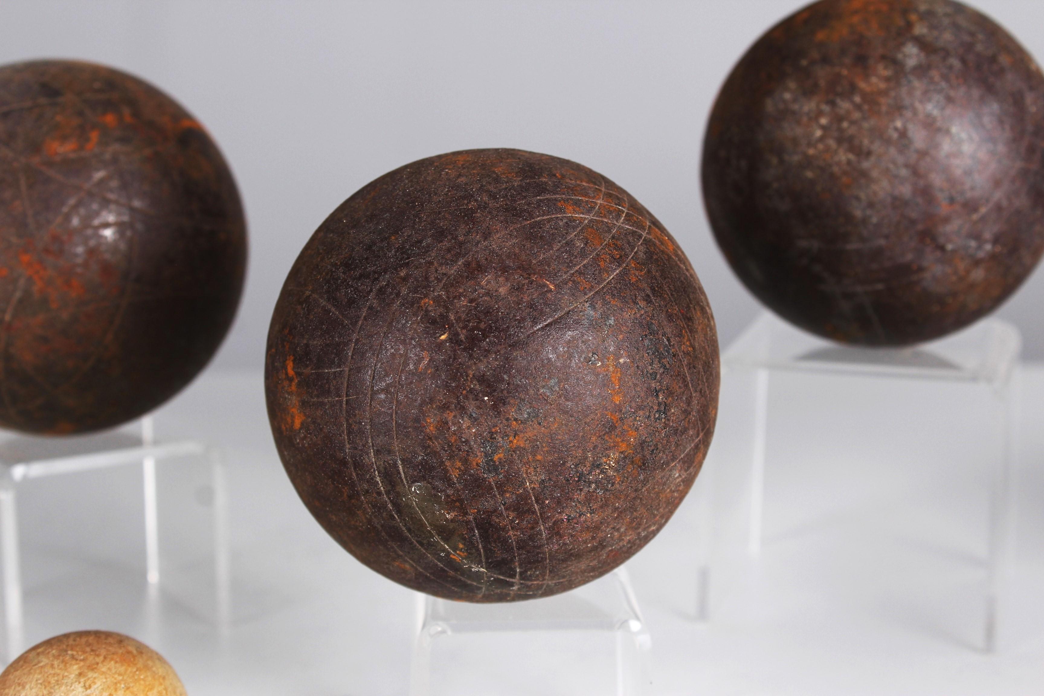 Beautiful, unique Boule set of three Boule balls and one target ball, France, late 19th Century.

Fantastic colour and patina!

In the 19th century, antique metal boules balls experienced a renaissance that took the game of boules to a new level.