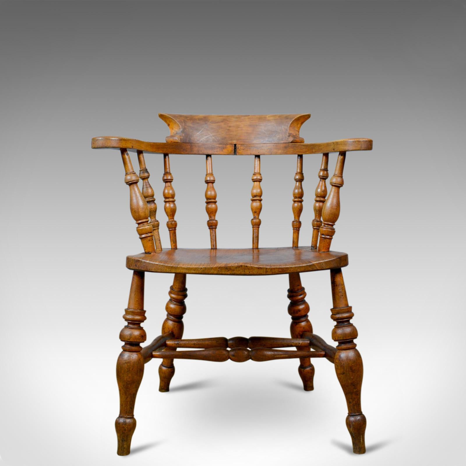 This is an antique bow-back elbow chair. An English, Victorian, elm, 'smokers', or 'captains', chair dating to circa 1890.

An appealing country kitchen, bow back armchair
Grain interest in a wax polished finish
Solid and stabile offering a