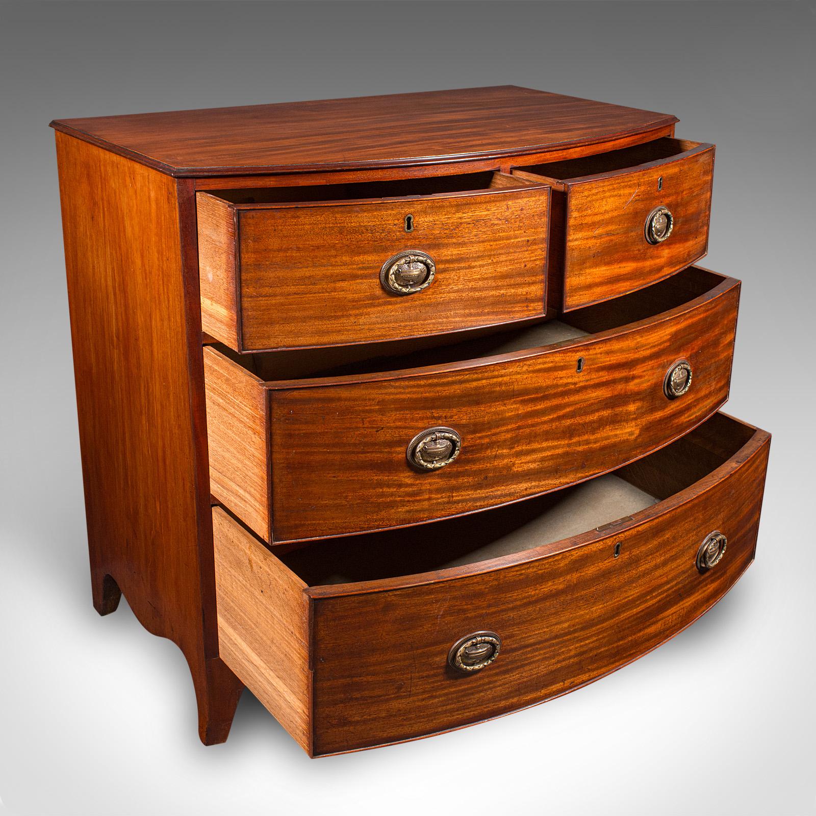 
This is an antique bow front chest of drawers. An English, flame mahogany bachelor's chest, dating to the Georgian period, circa 1790.

Graceful form and proportion to this exquisite Georgian example
Displaying a desirable aged patina and in very