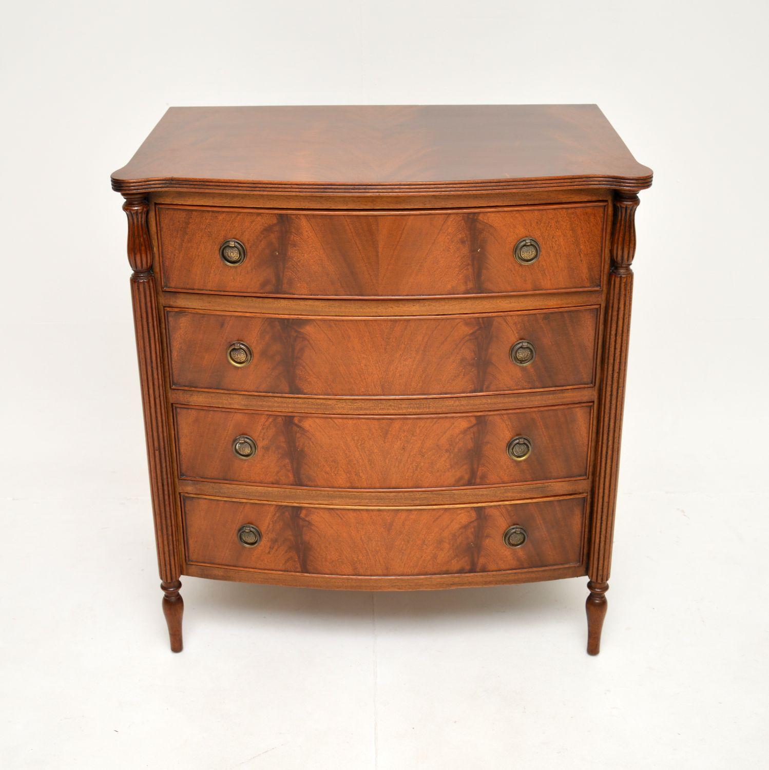 A beautiful antique bow front chest of drawers. This was made in England, it dates from around the 1930’s.

This is of superb quality and has some fine features. The drawer fronts have gorgeous flamed grain patterns with lovely brass ring pull