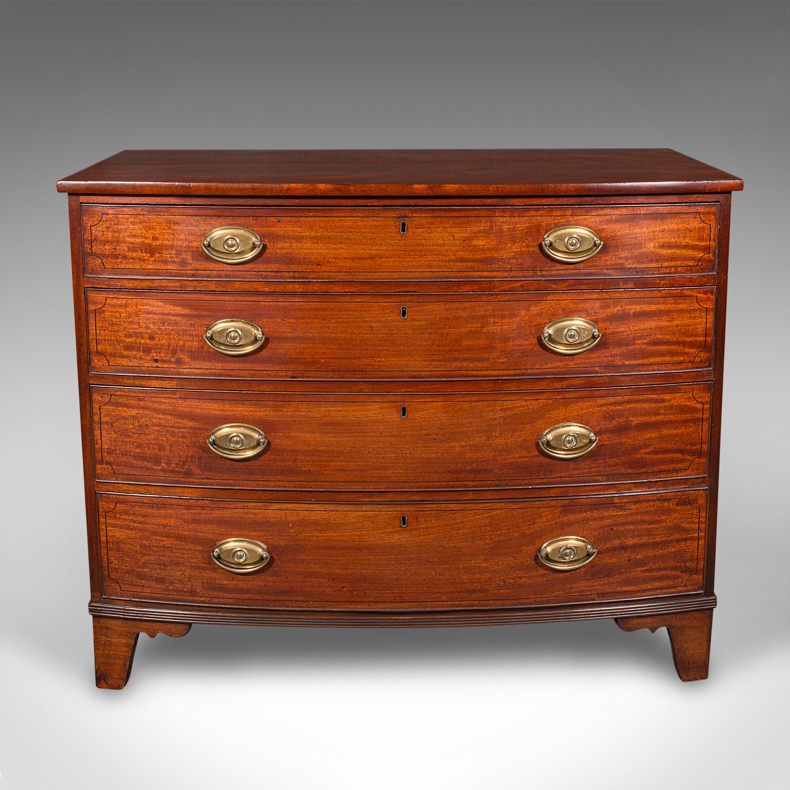 This is an antique bow front tallboy. An English, mahogany and brass chest of drawers, dating to the Georgian period, circa 1780.

Delightful bow front chest of four long drawers with beautiful figuring
Presenting a desirable aged patina and in good