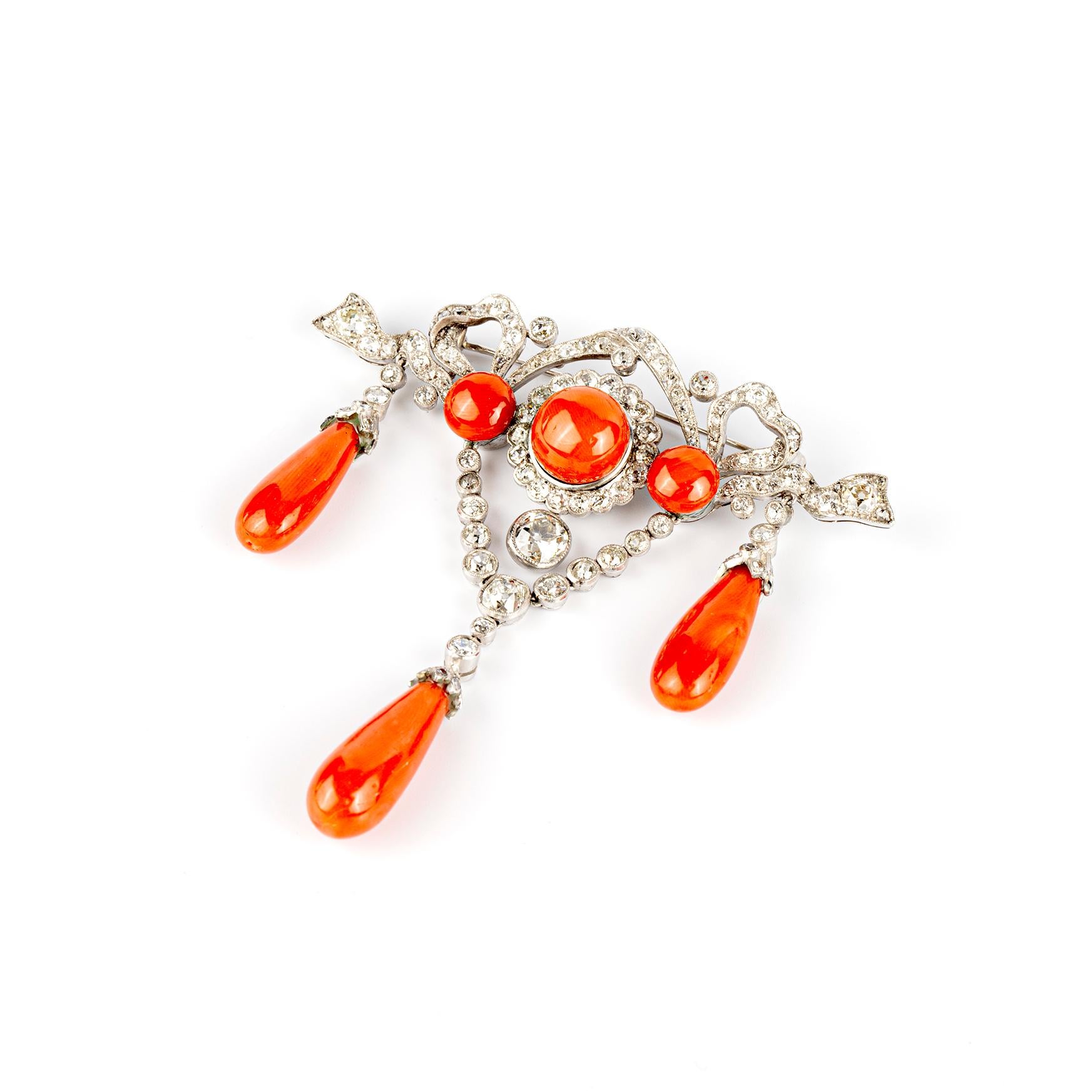 A late 19th Century Antique Brooch in the Bow Ribbon Style with Old Cut Diamonds and Fine Red Coral.