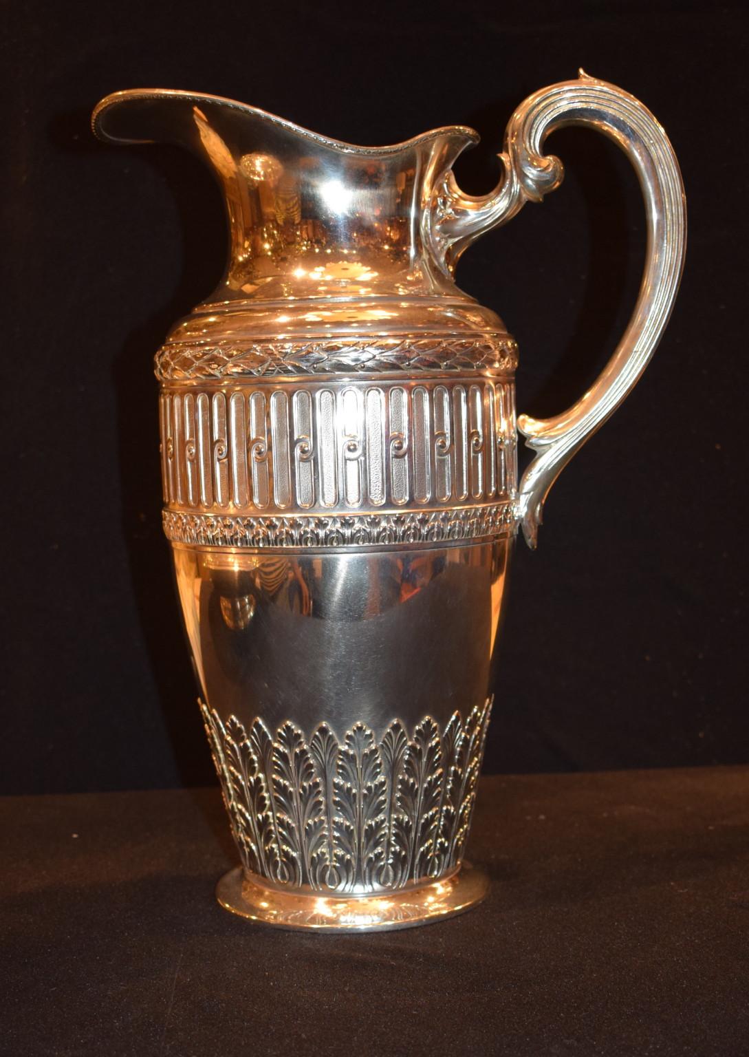 Late 19th century silver over bronze bowl and pitcher set in a neoclassical Adams style 
The pitcher is 14.5 inches tall. The bowl is 17.75 inches diameter.
 