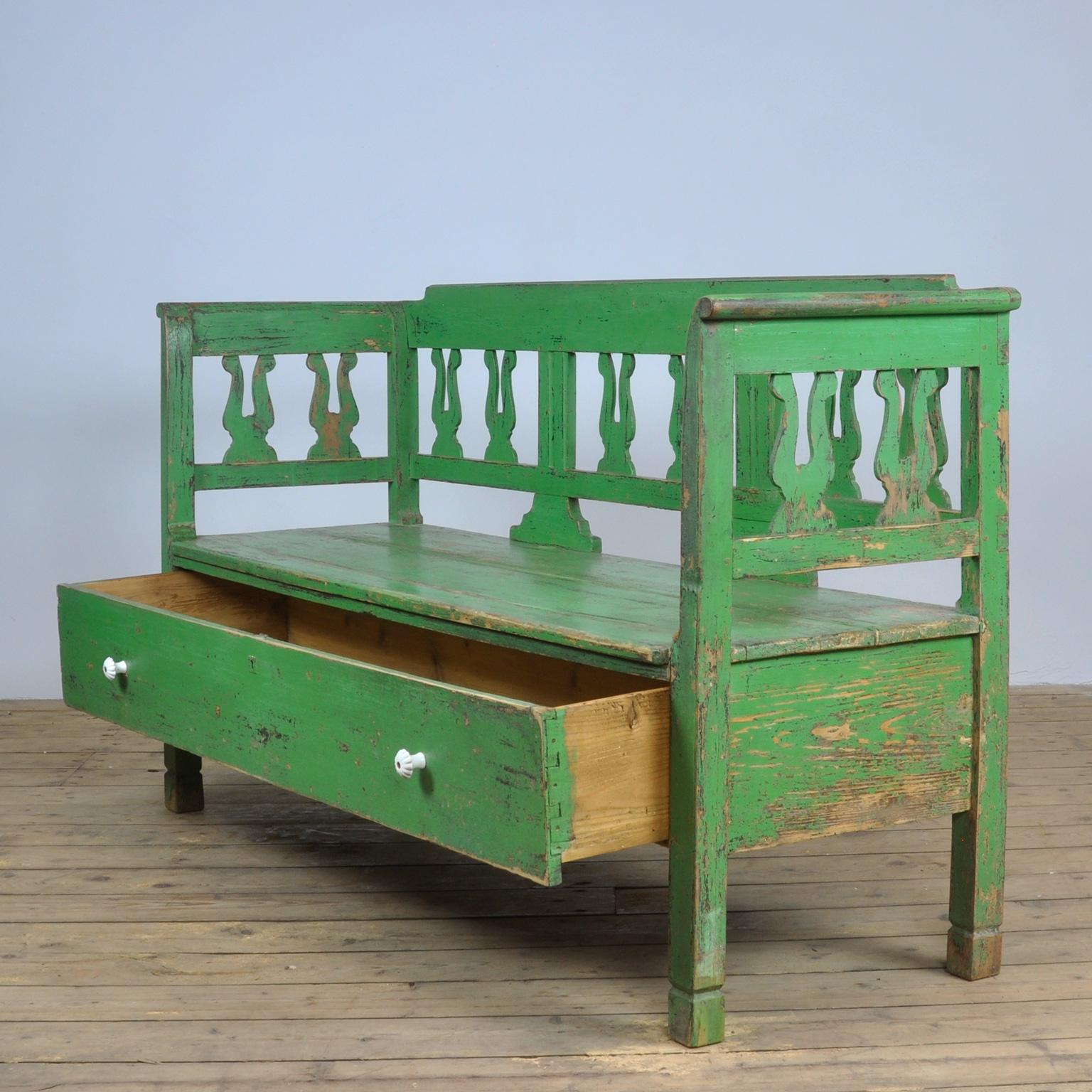 A charming box bench from Hungary, painted a striking shade of green. Under the seat a draw with large storage space.