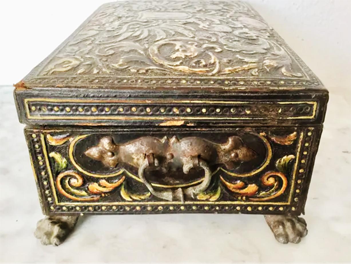 Antique box lined with hand-embossed leather (cordoman) and silk velvet inside

Antique chest or jewelry box made of embossed leather (Cordoman) and lined with maroon silk velvet

The Cordoman is a typical traditional craft of Cordoba, Spain. It