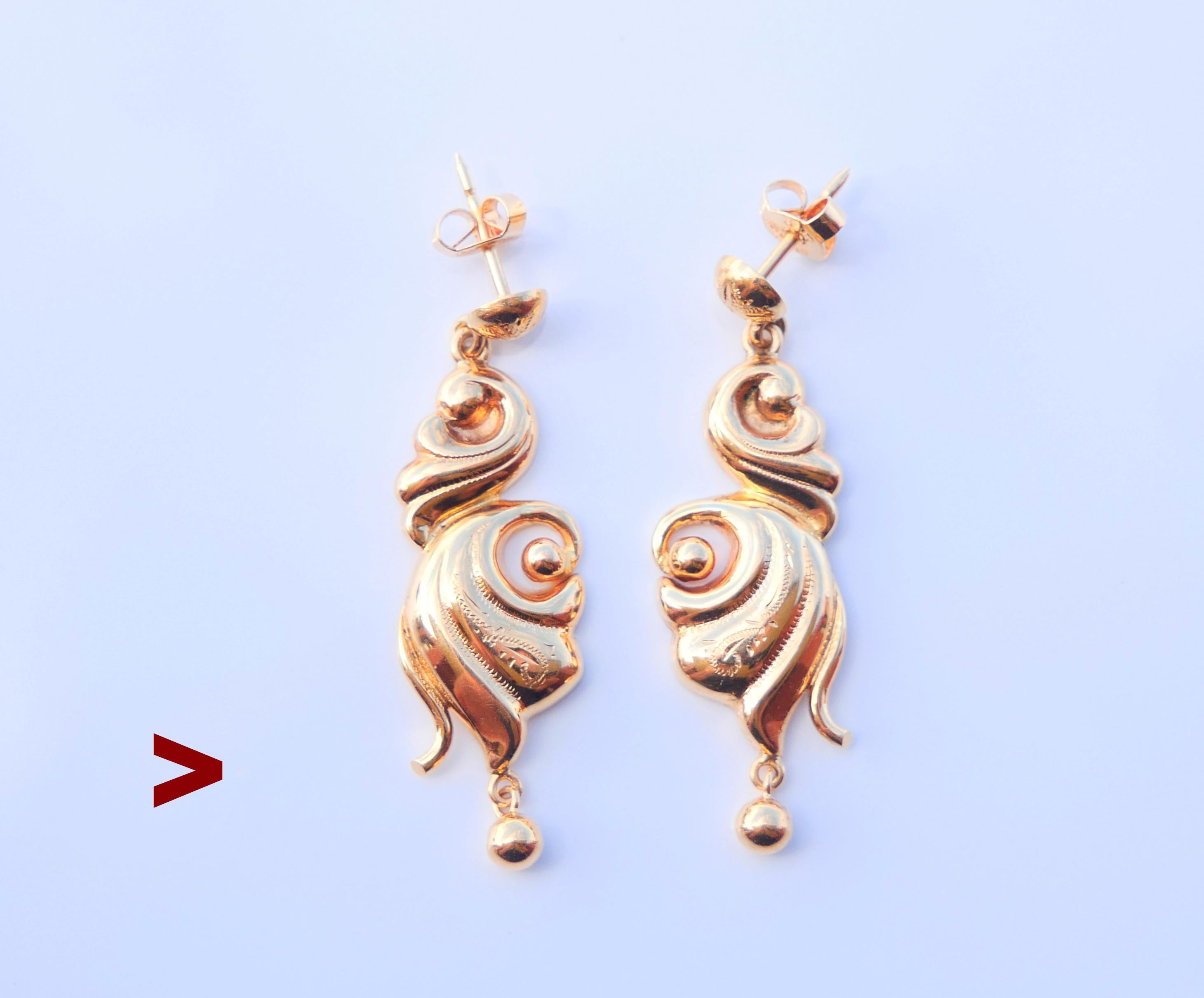 A pair of old dangle Earrings from ca. 1930s- 1940s in solid 18K Gold , each measuring  43 mm x 13 mm. Hollow bodies, hand -engraved, terminated with suspended balls. Stoppers with Swedish hallmarks, 18K. 

Weight : 7.76 grams pair.

In used finest